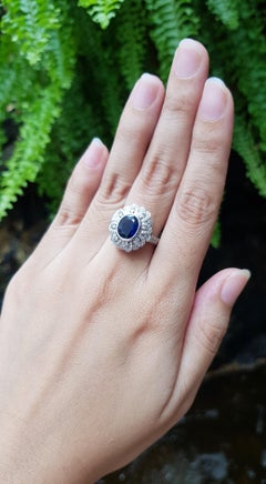 Blue Sapphire with Diamond Ring Set in 18 Karat White Gold Settings