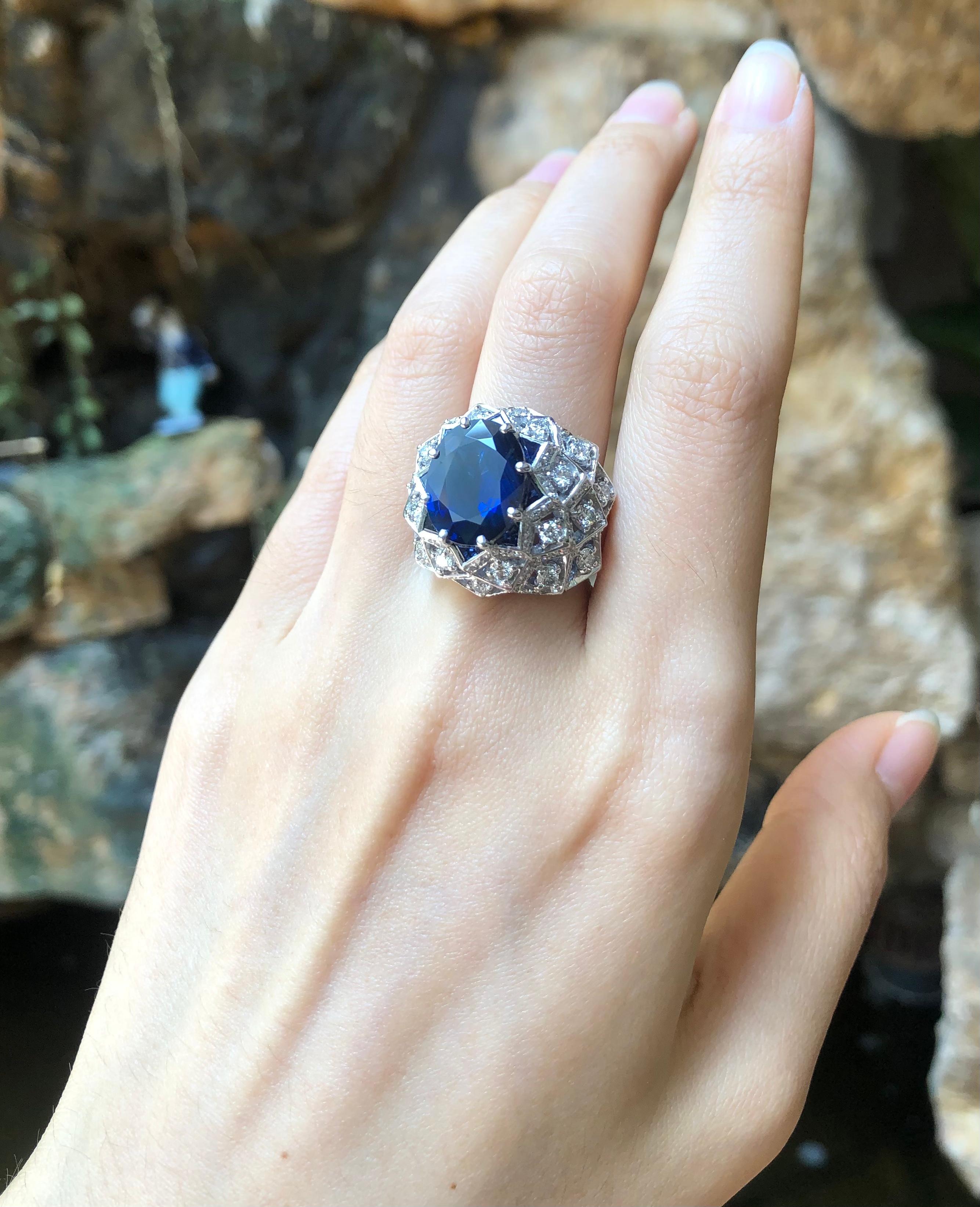 Blue Sapphire 6.67 carats with Blue Sapphire 2.13 carats and Diamond 2.56 carats Ring set in 18 Karat White Gold Settings

Width:  1.1 cm 
Length: 1.4 cm
Ring Size: 54
Total Weight: 19.42 grams

