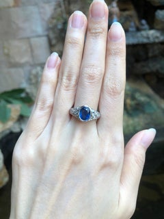 Blue Sapphire with Diamond Ring Set in 18 Karat White Gold Settings