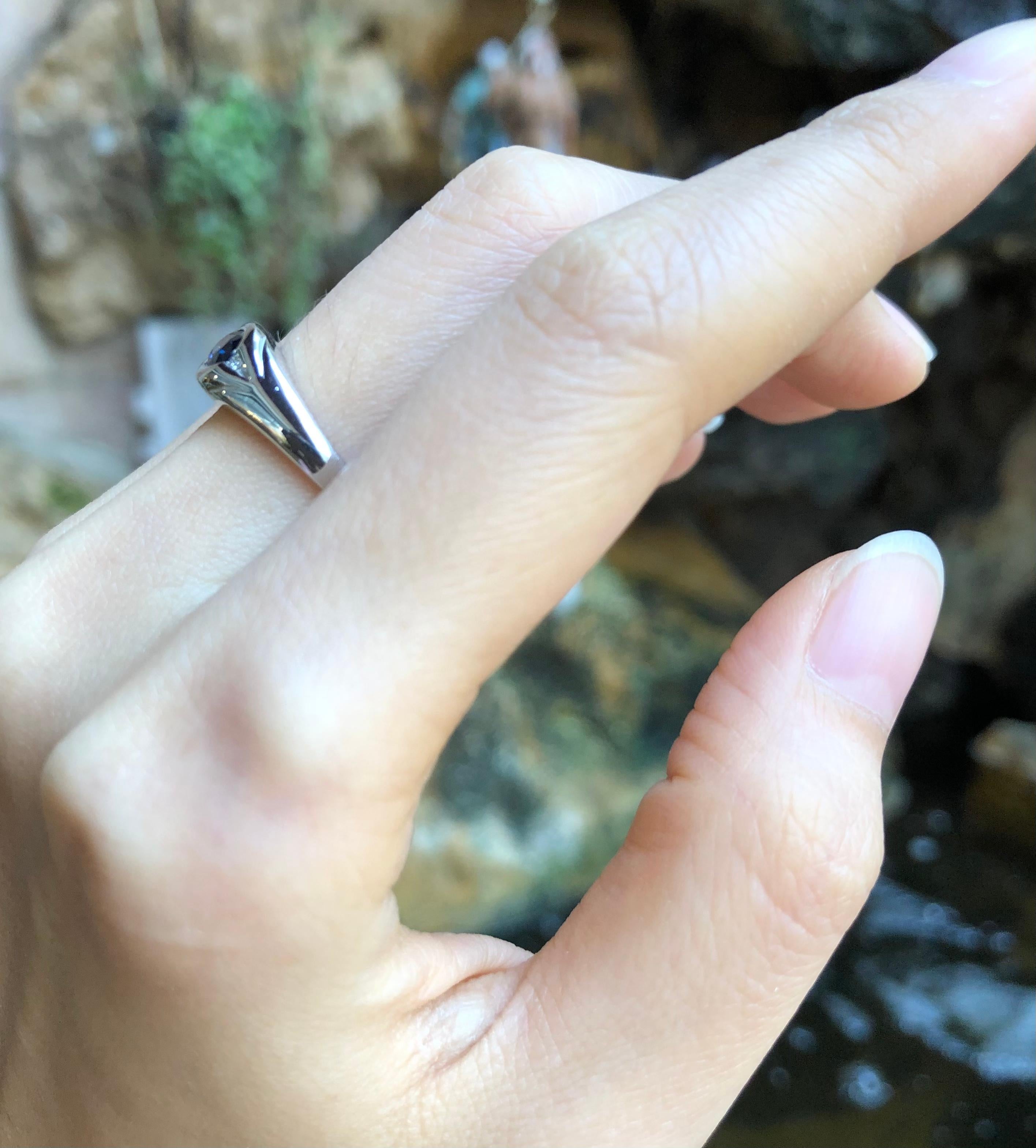Blue Sapphire 0.63 carats with Diamond 0.02  carat Ring set in 18 Karat White Gold Settings

Width:  0.7 cm 
Length: 0.8 cm
Ring Size: 53
Total Weight: 4.13 grams


