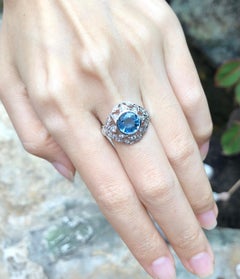 Blue Sapphire with Diamond Ring Set in 18 Karat White Gold Settings