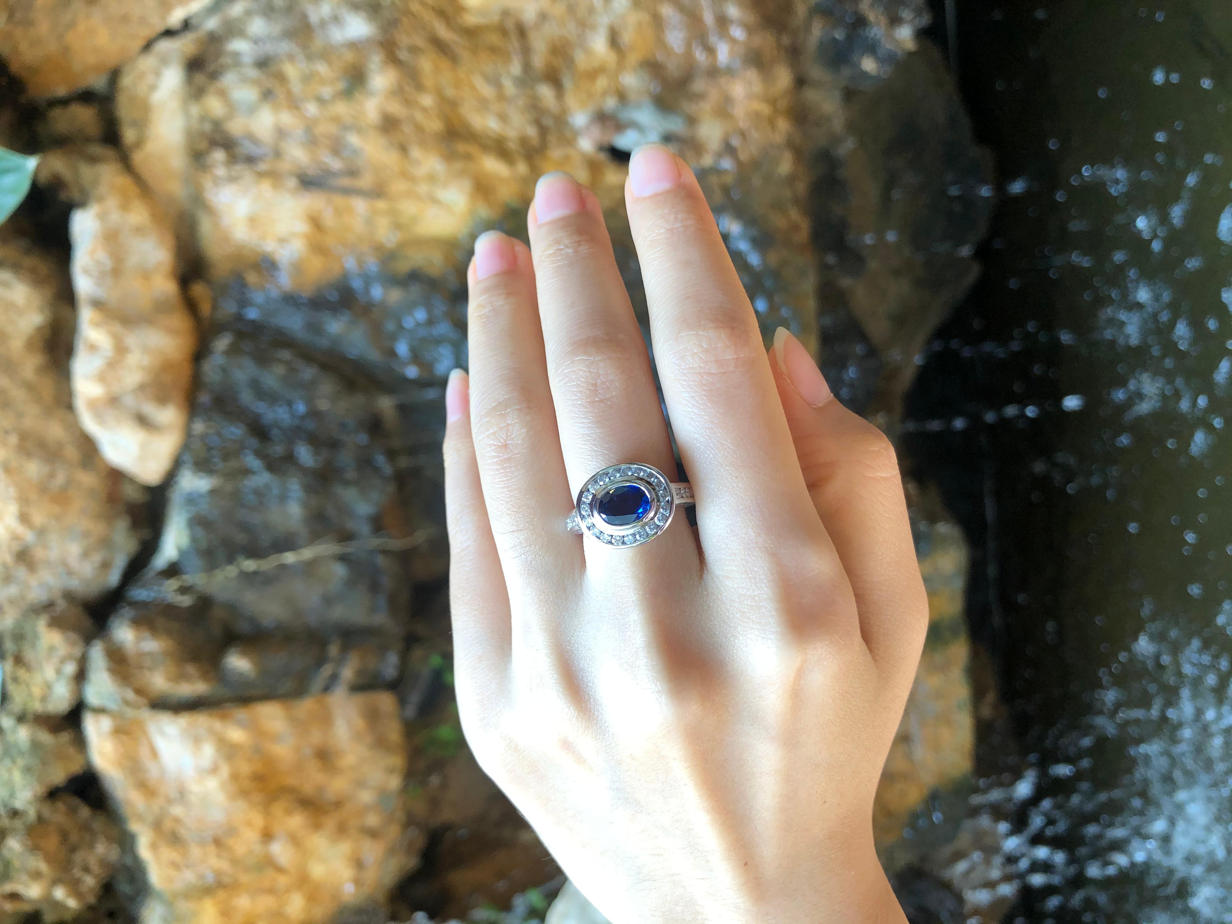 Contemporary Blue Sapphire with Diamond Ring Set in 18 Karat White Gold Settings For Sale