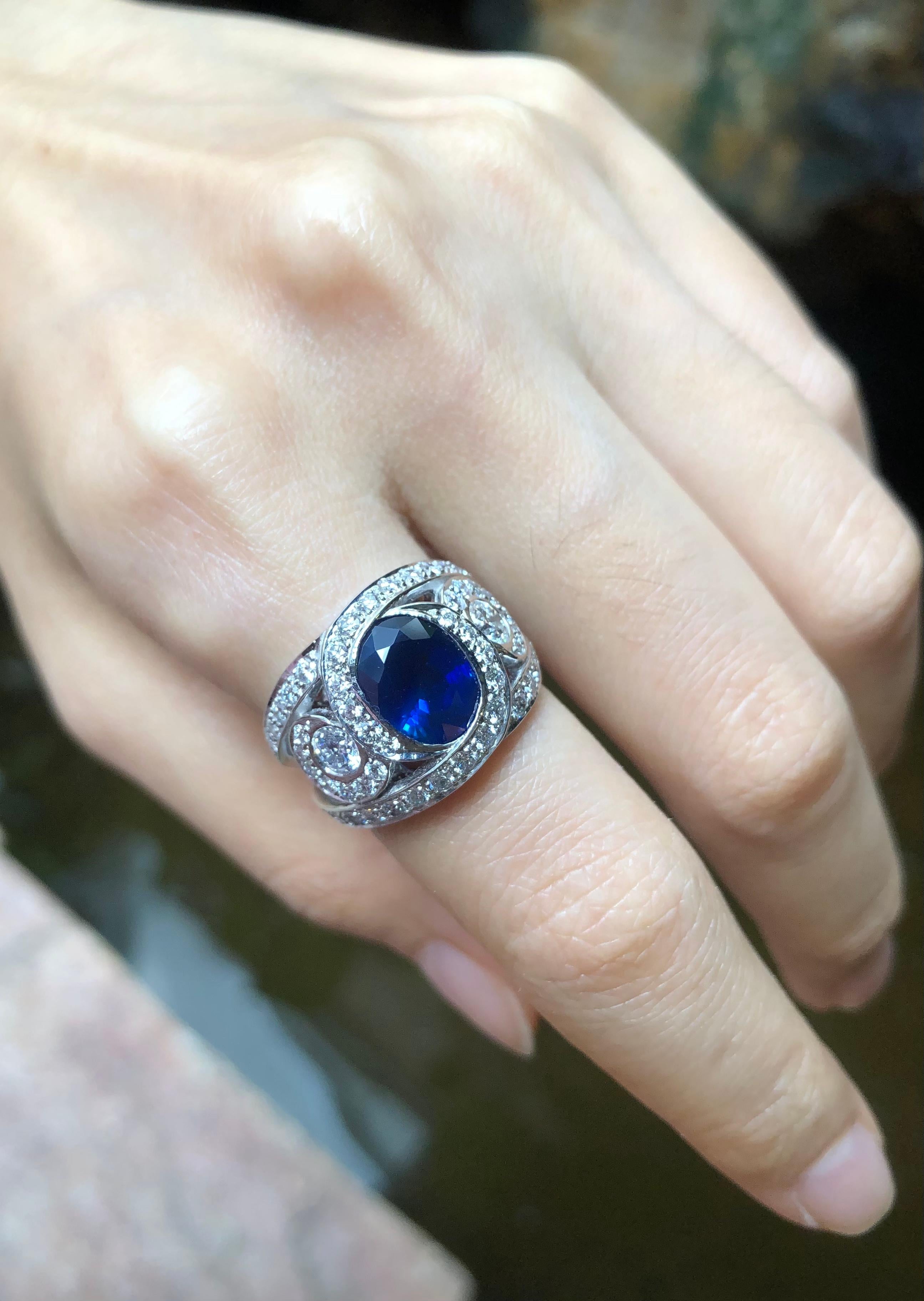 Contemporary Blue Sapphire with Diamond Ring Set in 18 Karat White Gold Settings For Sale