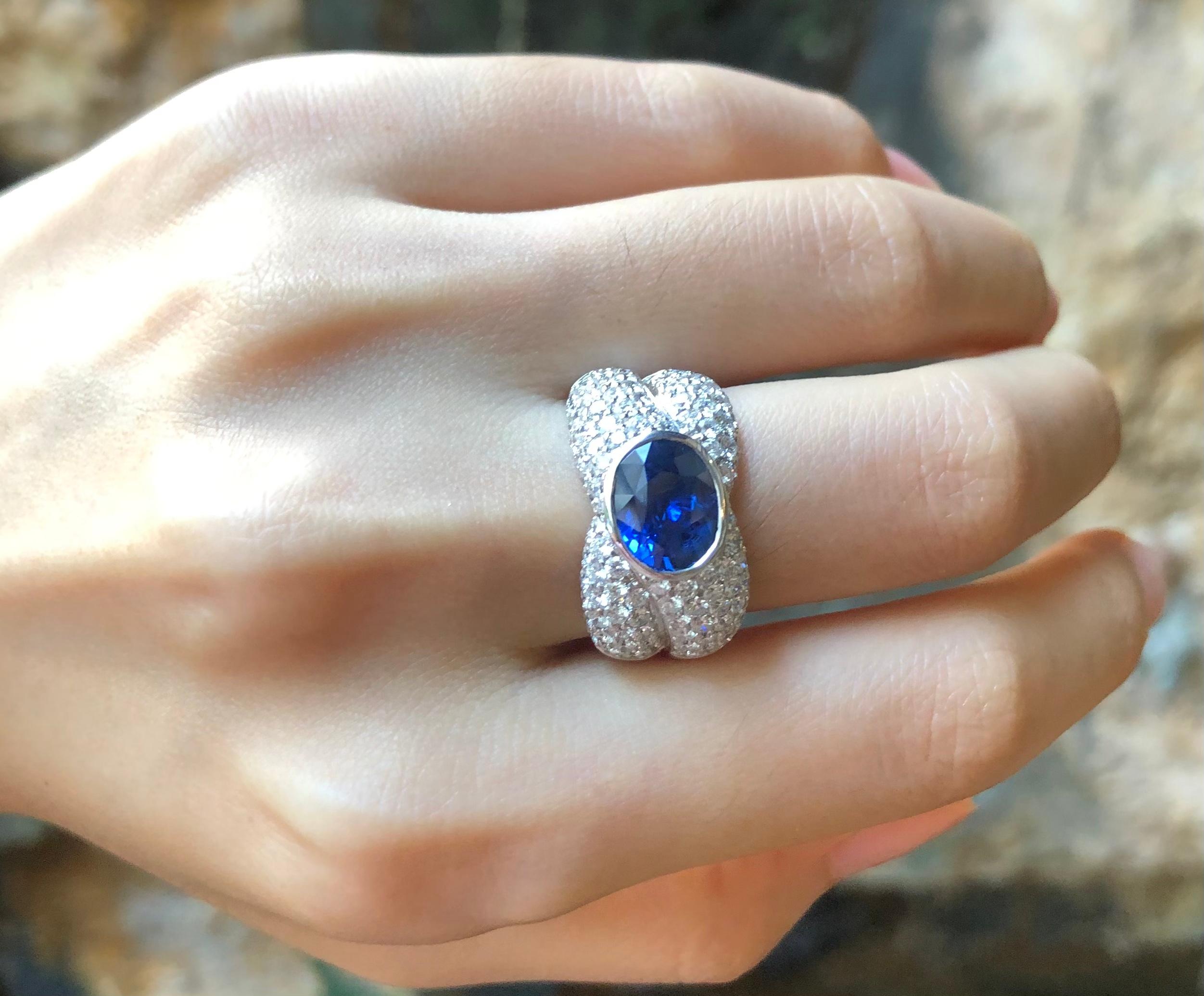 Contemporary Blue Sapphire with Diamond Ring Set in 18 Karat White Gold Settings For Sale