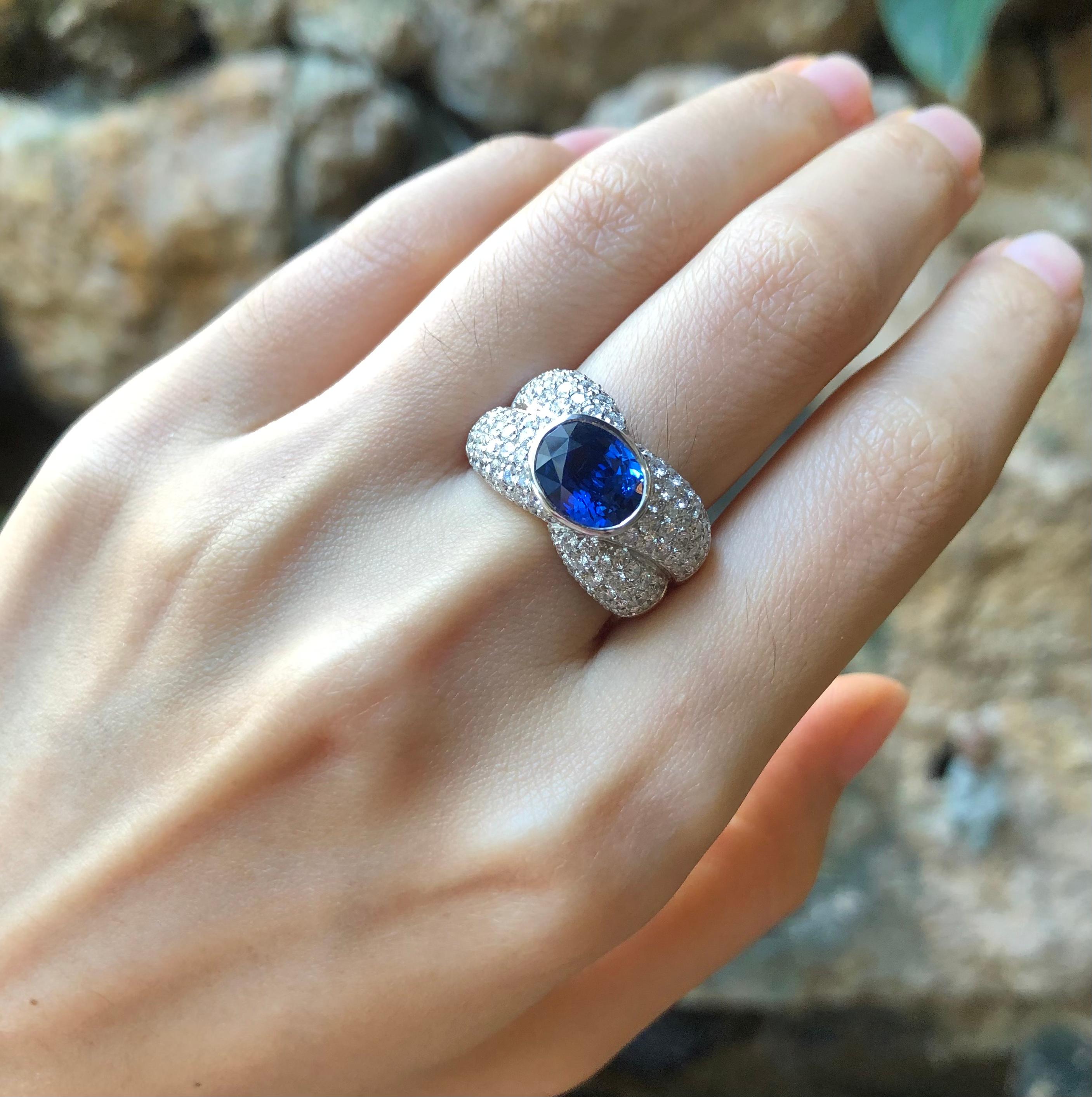 Oval Cut Blue Sapphire with Diamond Ring Set in 18 Karat White Gold Settings For Sale
