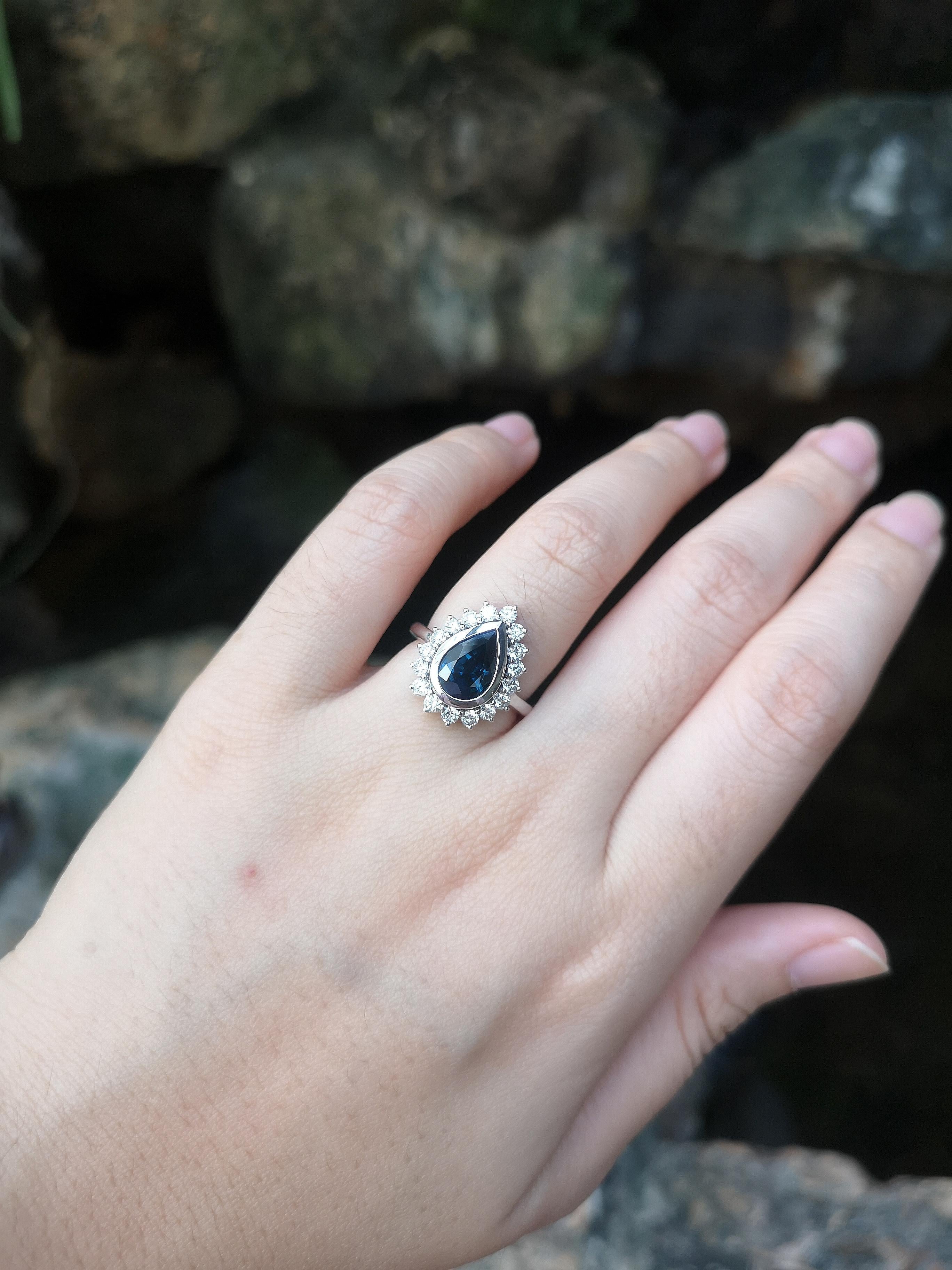 Pear Cut Blue Sapphire with Diamond Ring Set in 18 Karat White Gold Settings For Sale