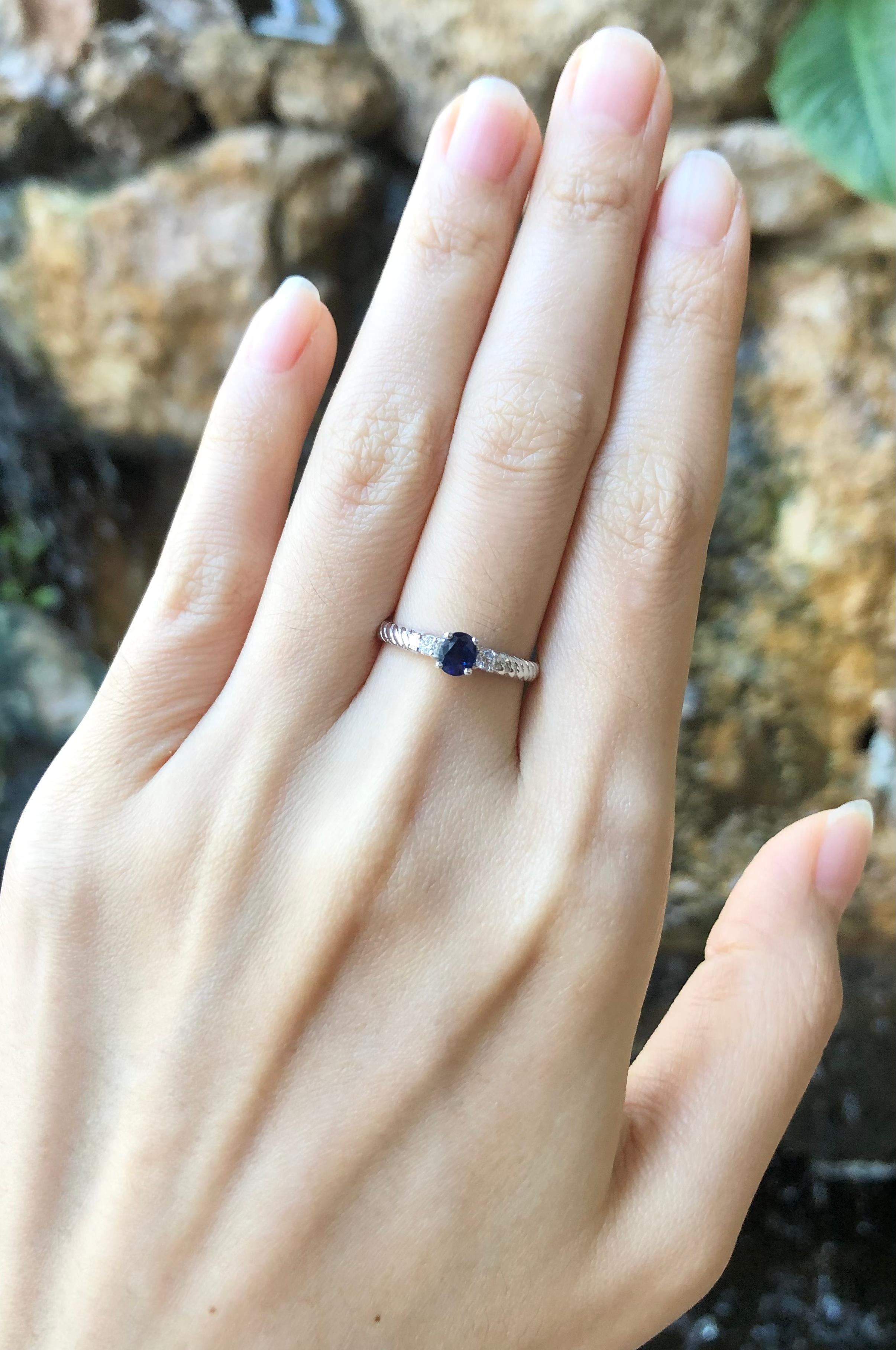 Oval Cut Blue Sapphire with Diamond Ring set in 18 Karat White Gold Settings For Sale