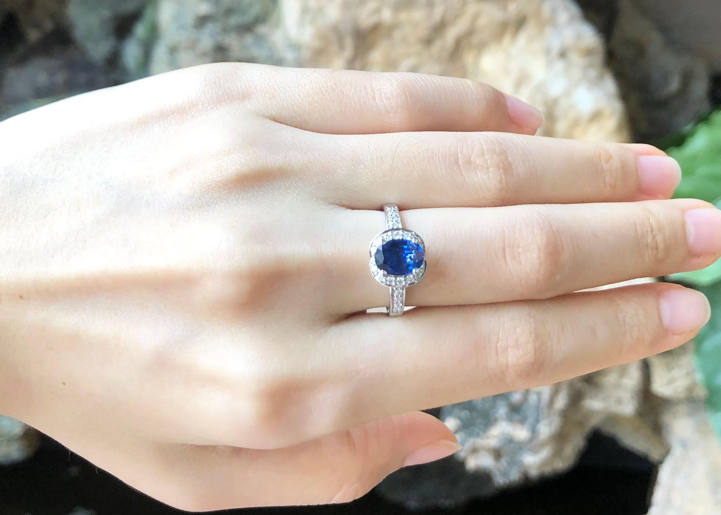 Oval Cut Blue Sapphire with Diamond Ring Set in 18 Karat White Gold Settings For Sale