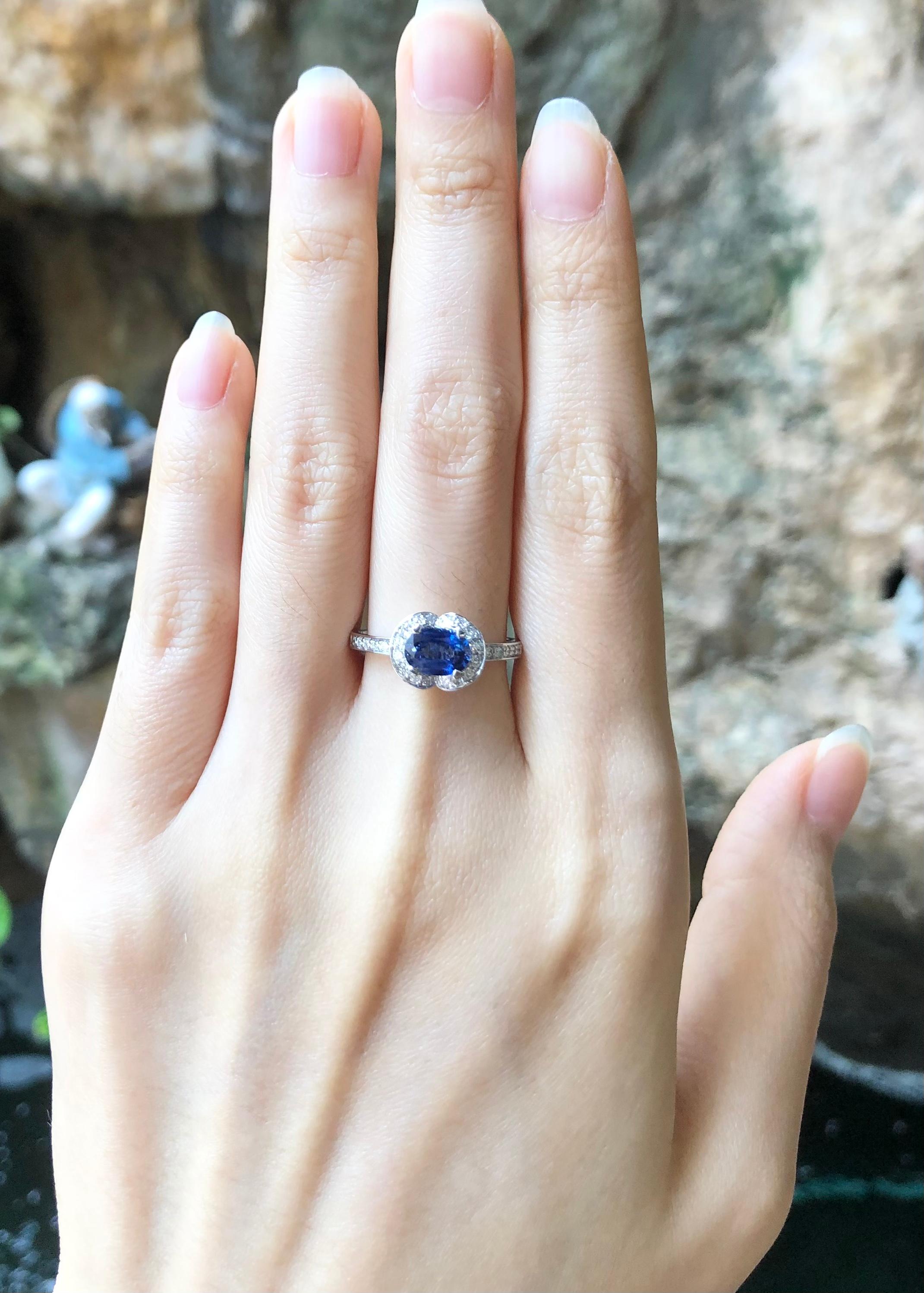 Oval Cut Blue Sapphire with Diamond Ring set in 18 Karat White Gold Settings For Sale