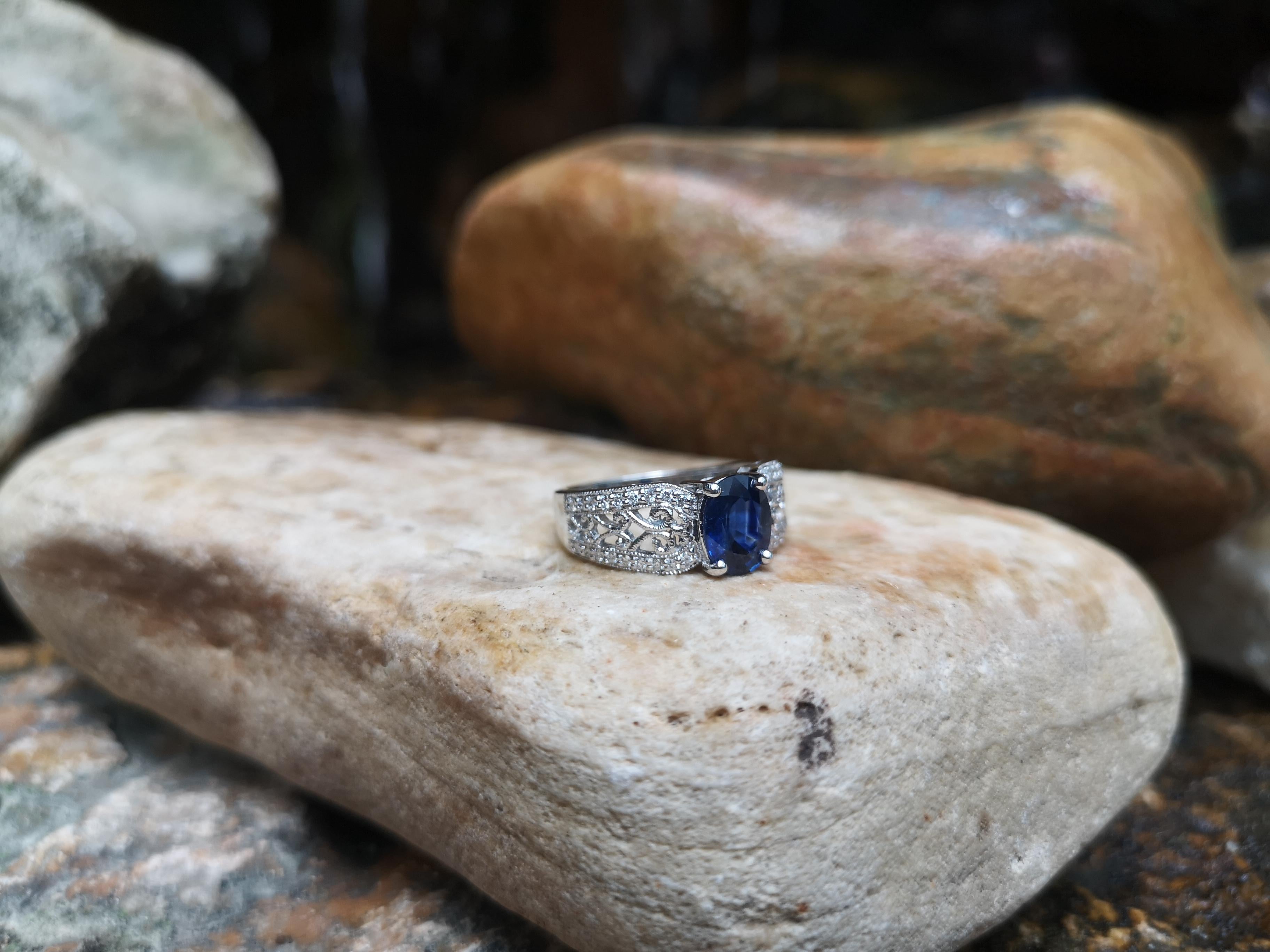 Contemporary Blue Sapphire with Diamond Ring Set in 18 Karat White Gold Settings For Sale