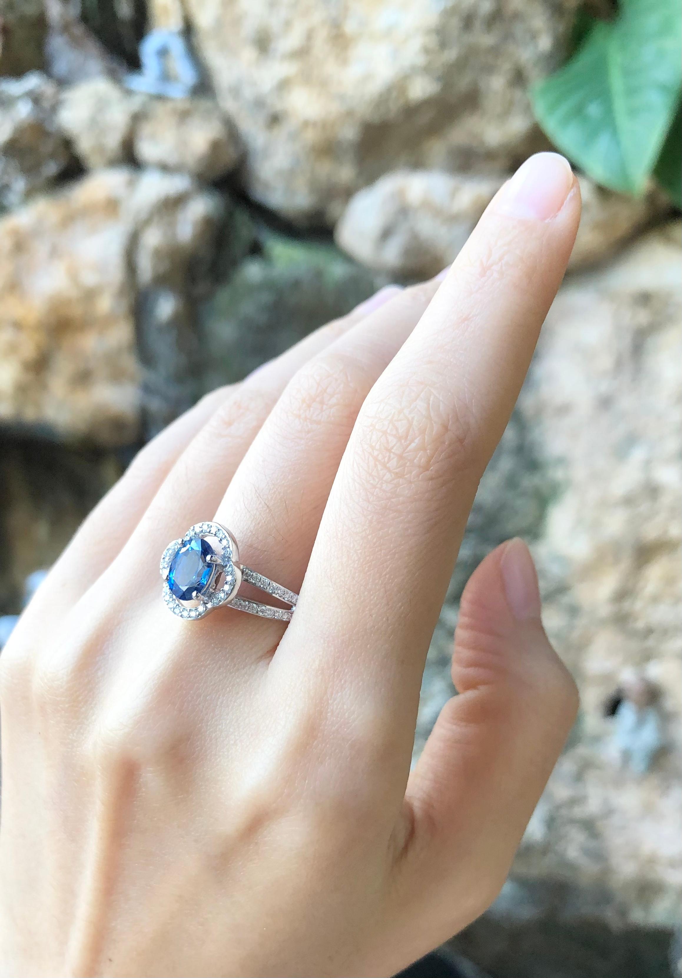 Contemporary Blue Sapphire with Diamond Ring Set in 18 Karat White Gold Settings For Sale