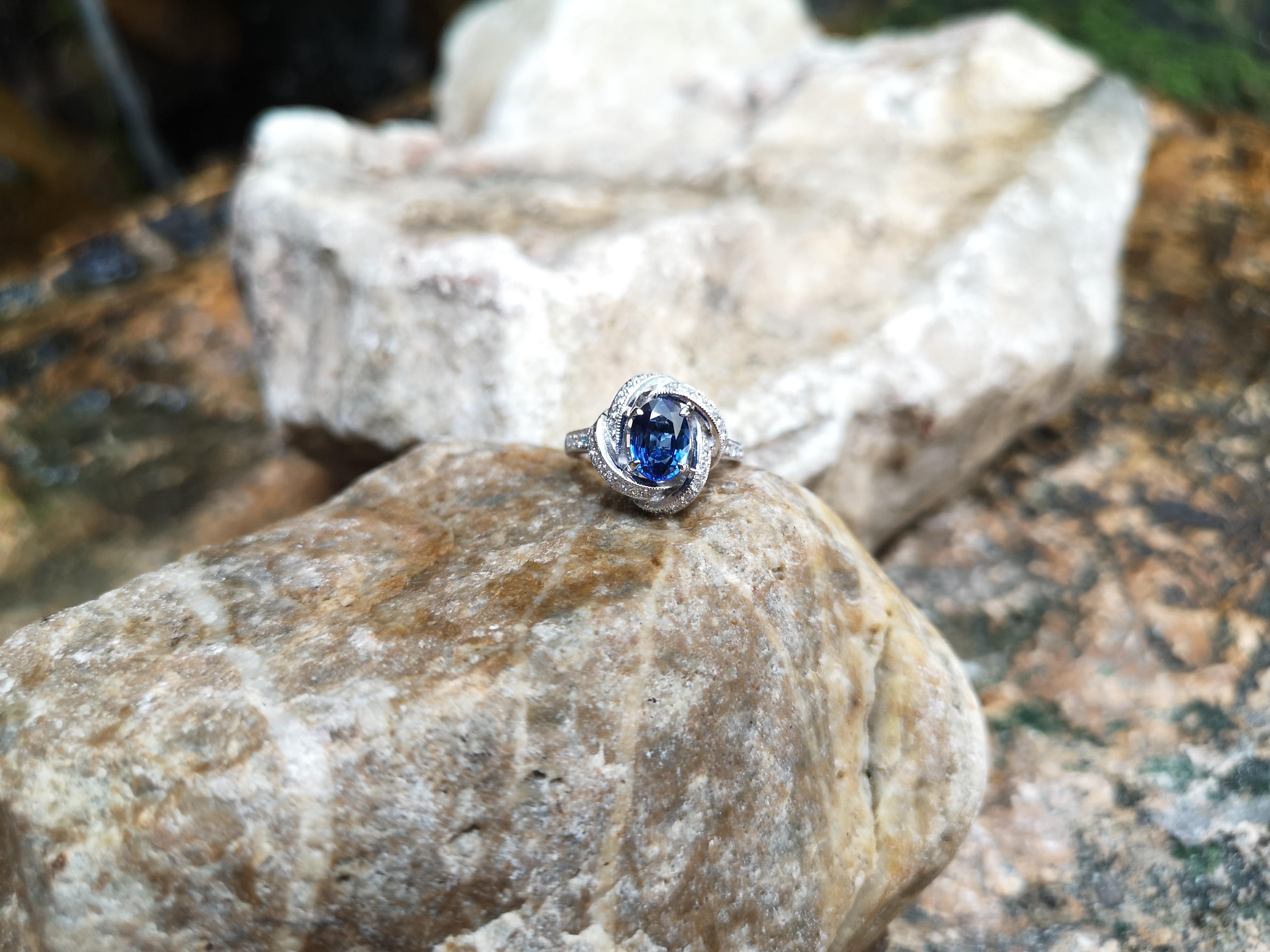 Women's Blue Sapphire with Diamond Ring Set in 18 Karat White Gold Settings For Sale