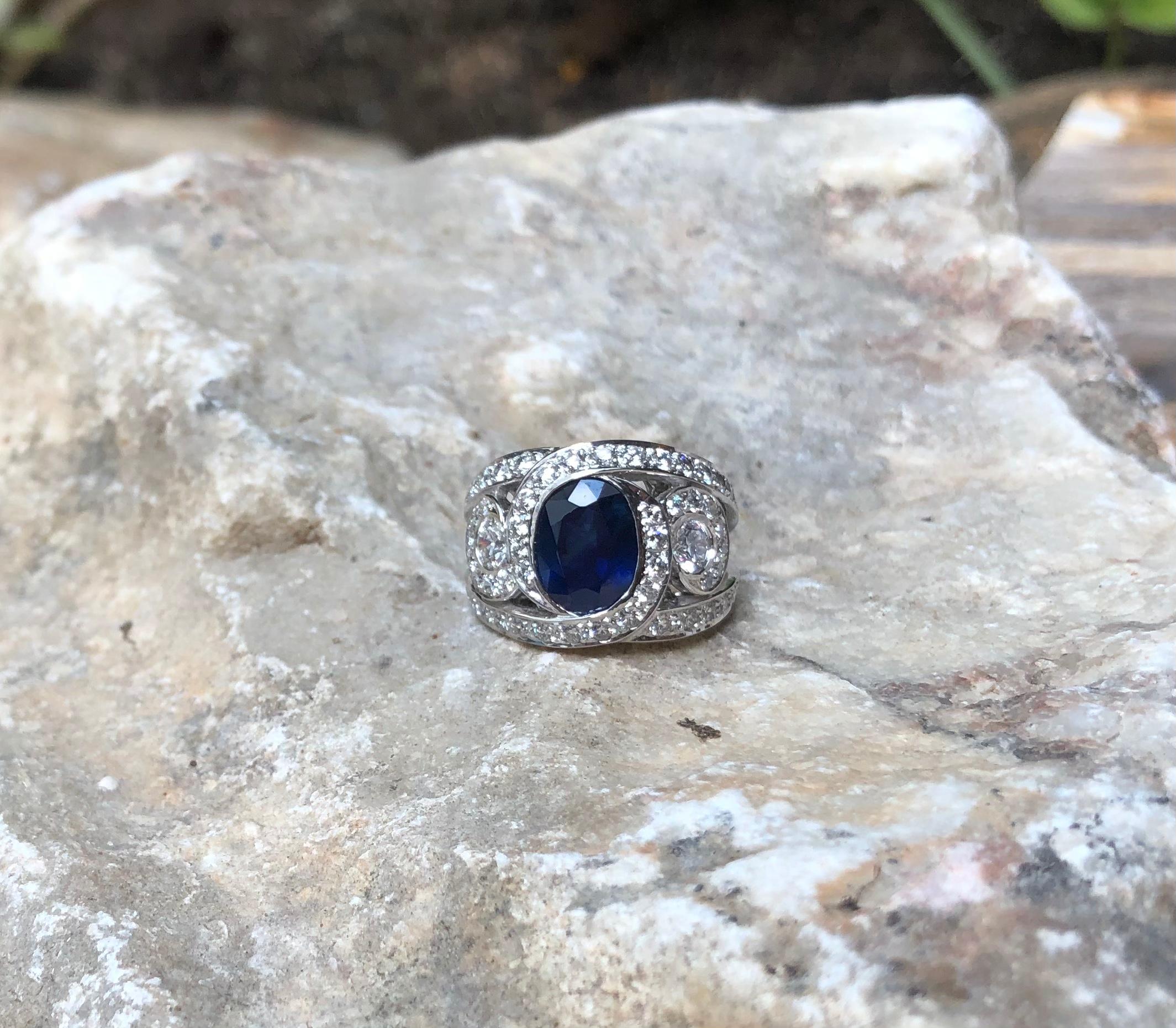 Women's Blue Sapphire with Diamond Ring Set in 18 Karat White Gold Settings For Sale