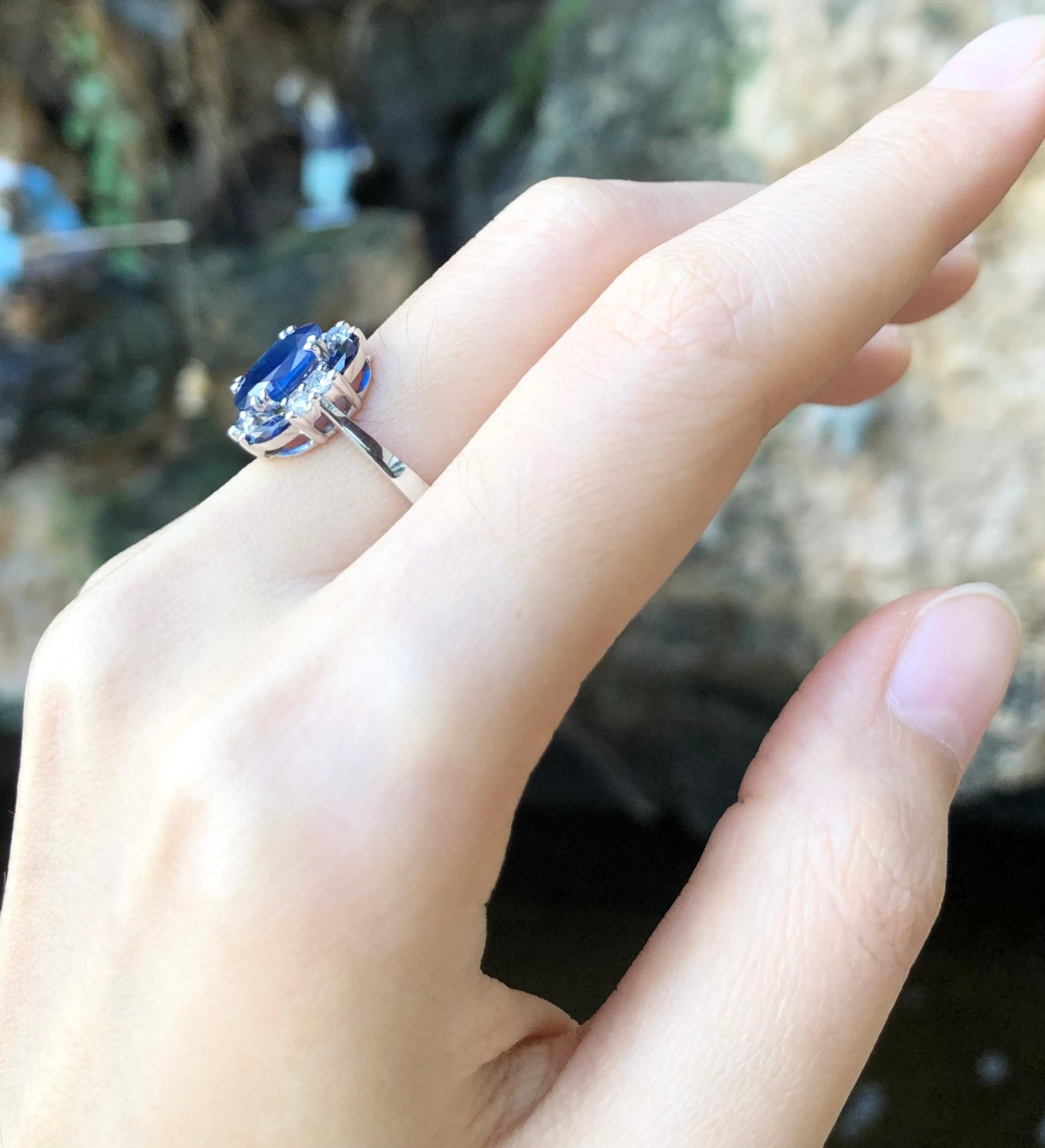 Women's Blue Sapphire with Diamond Ring Set in 18 Karat White Gold Settings For Sale