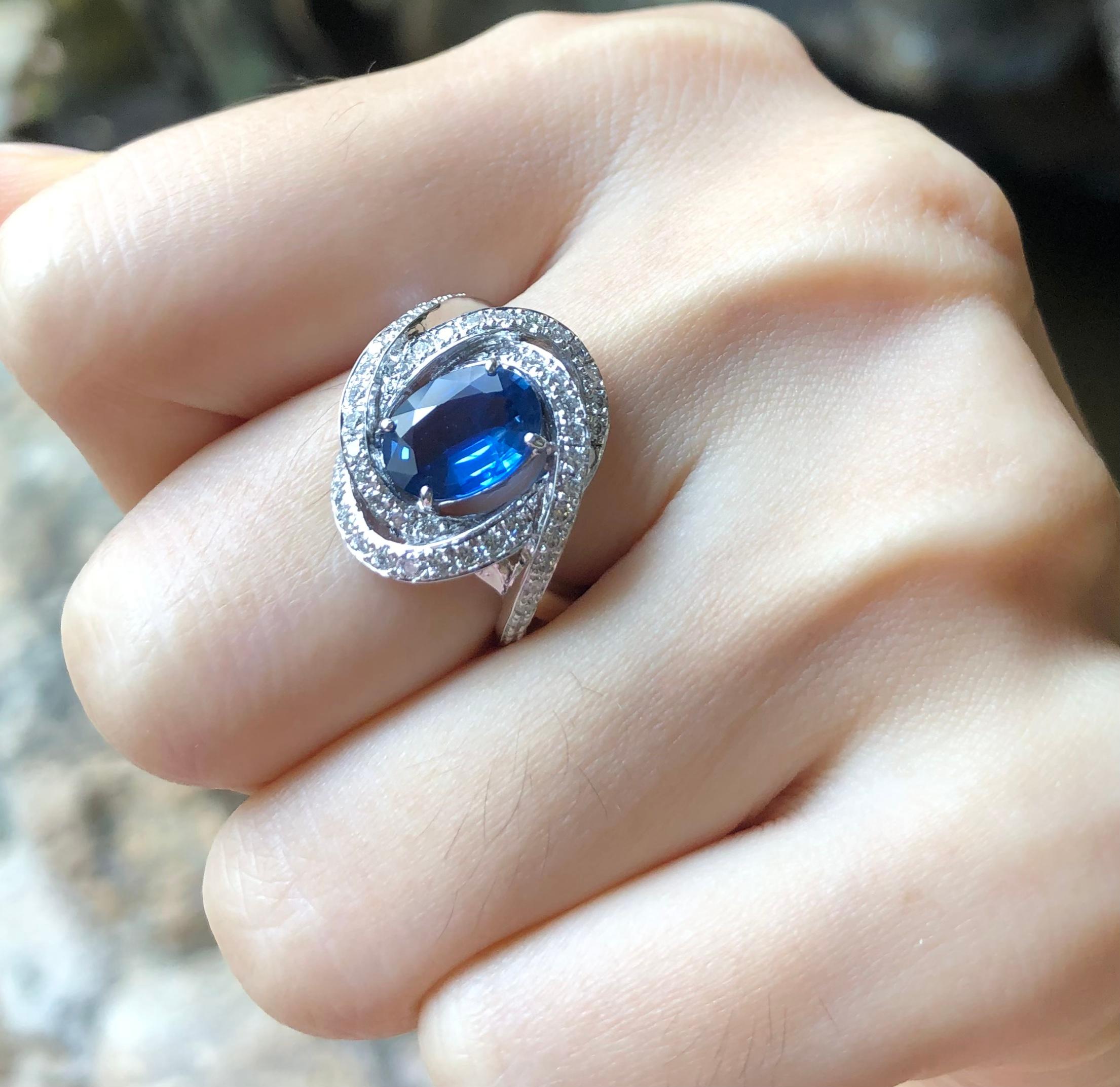 Oval Cut Blue Sapphire with Diamond Ring Set in 18 Karat White Gold Settings For Sale