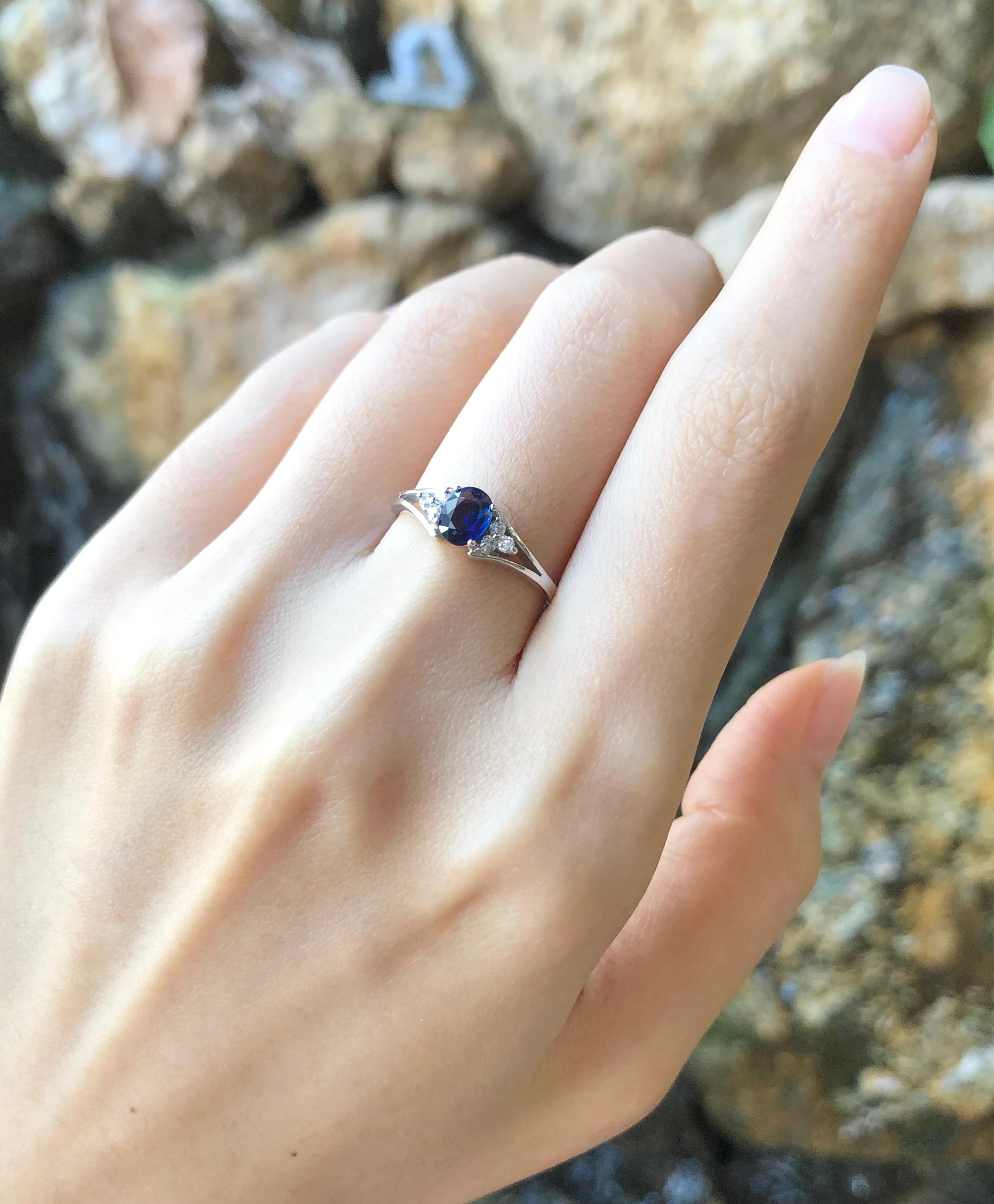 Women's Blue Sapphire with Diamond Ring Set in 18 Karat White Gold Settings For Sale