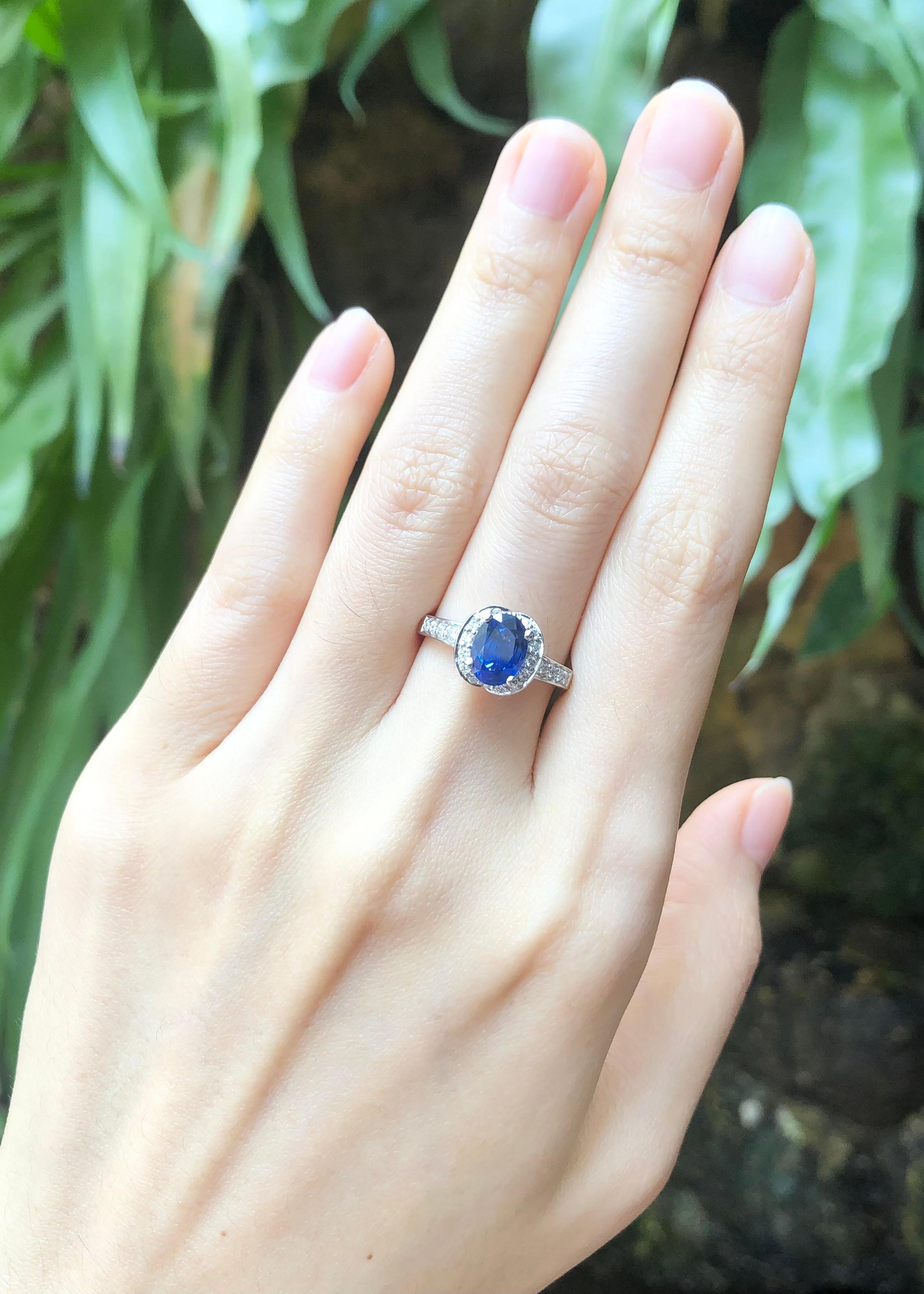 Women's Blue Sapphire with Diamond Ring Set in 18 Karat White Gold Settings For Sale