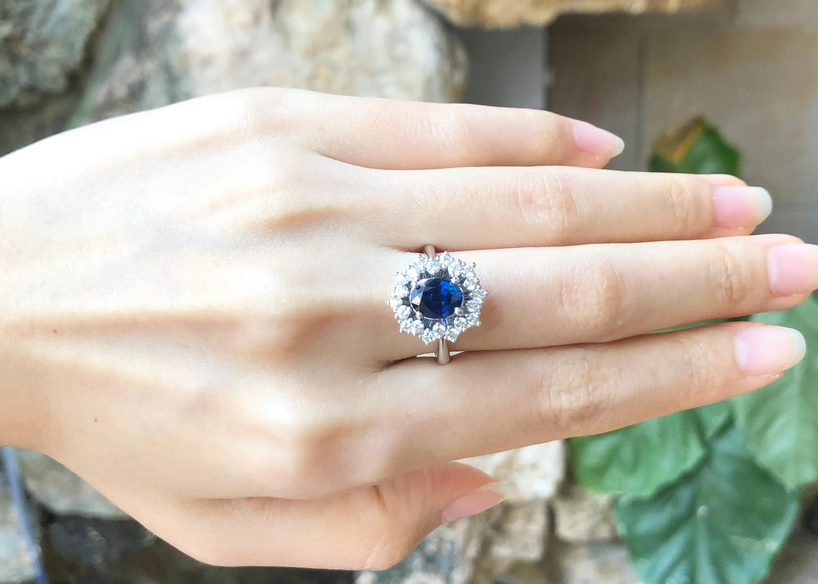 Contemporary Blue Sapphire with Diamond Ring set in 18 Karat White Gold Settings For Sale