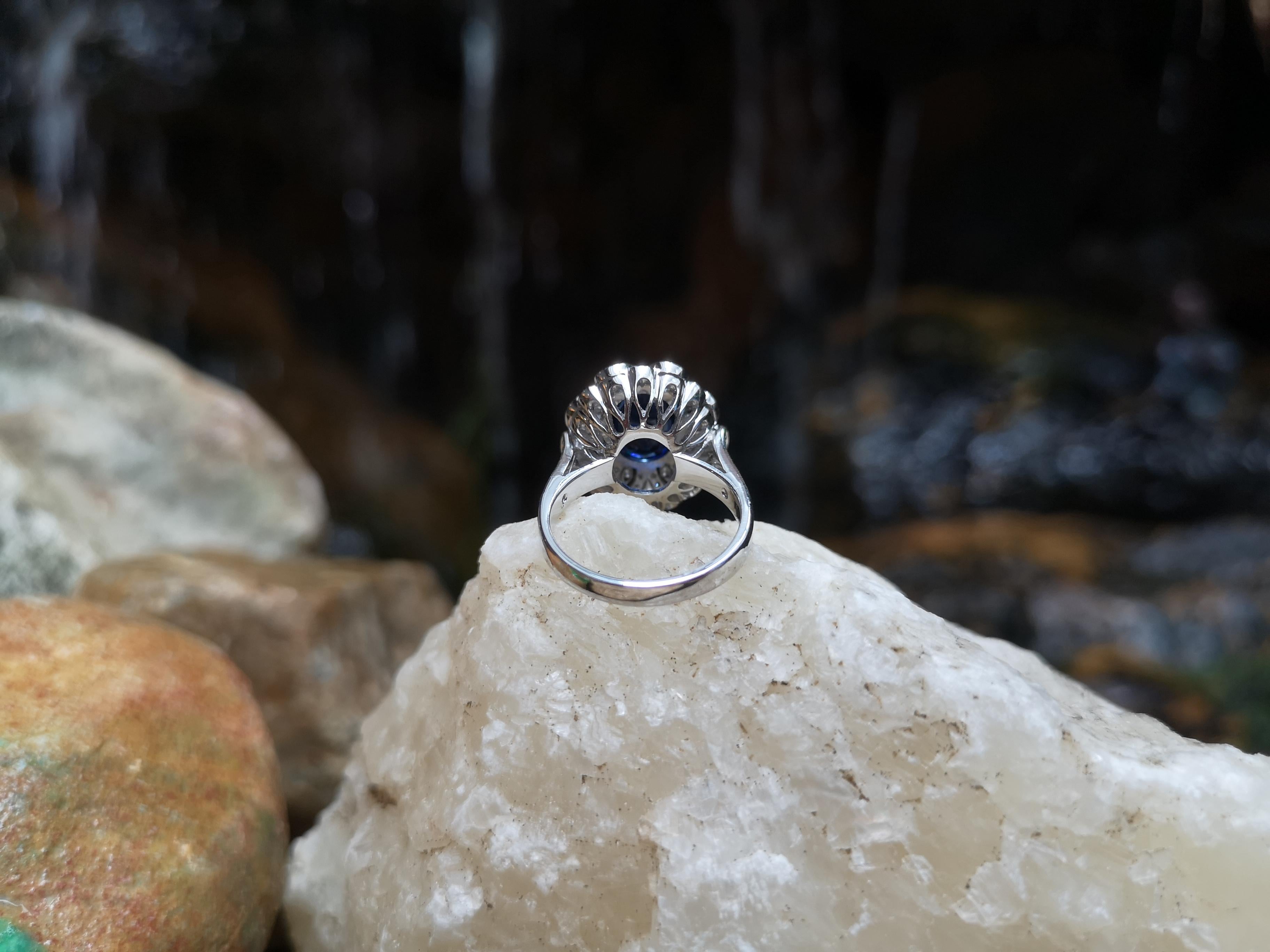 Oval Cut Blue Sapphire with Diamond Ring Set in 18 Karat White Gold Settings For Sale