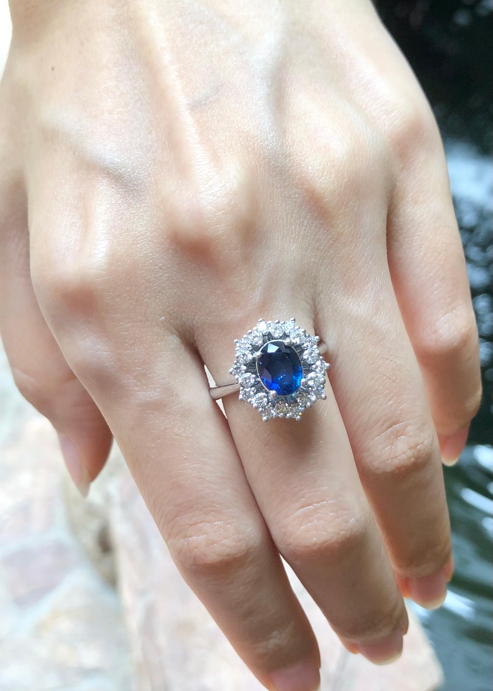 Oval Cut Blue Sapphire with Diamond Ring set in 18 Karat White Gold Settings For Sale