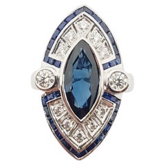 Bague en or blanc 18 carats sertie d'un saphir bleu et de diamants