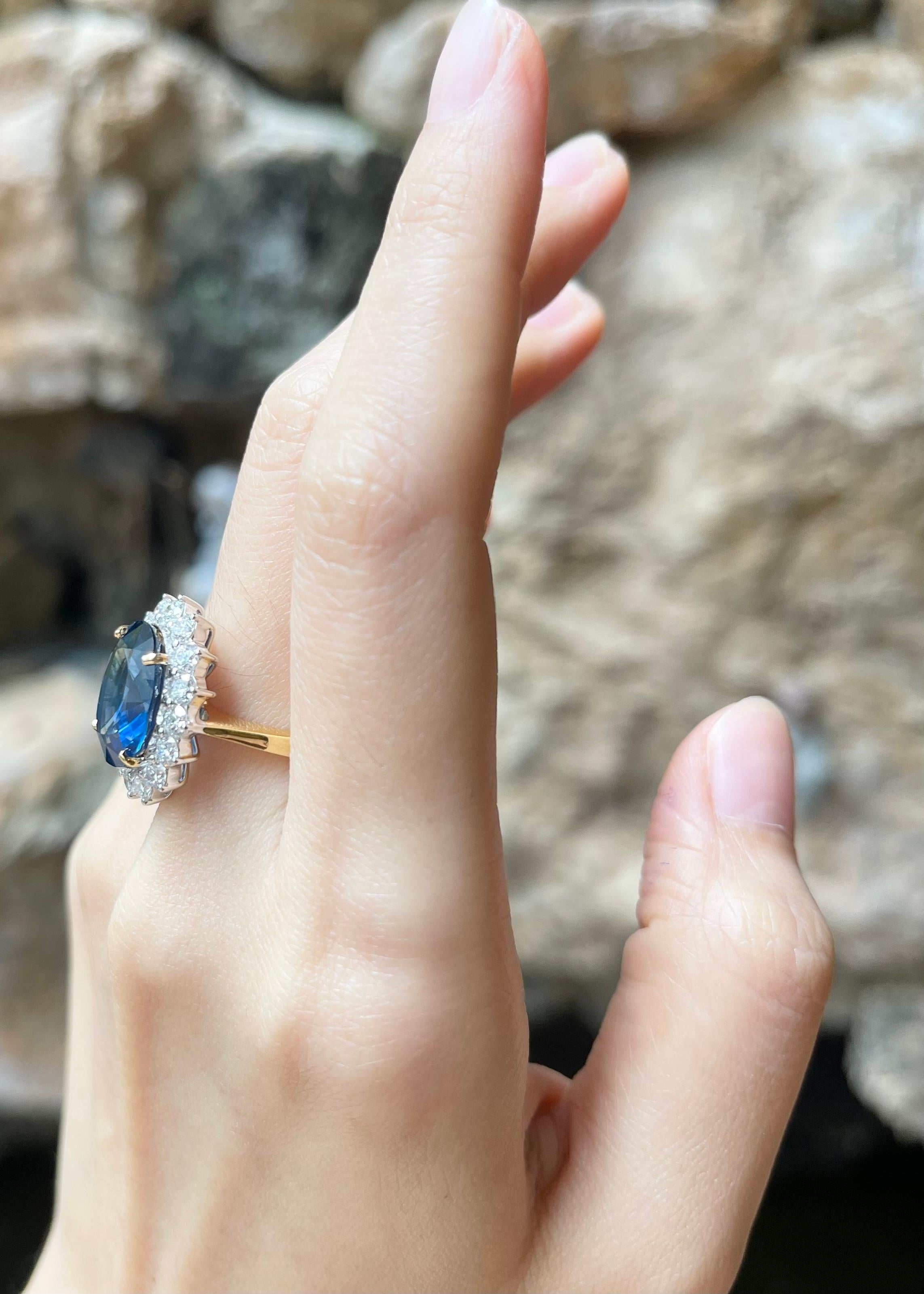 Contemporary Blue Sapphire with Diamond Ring set in 18K Gold Settings For Sale