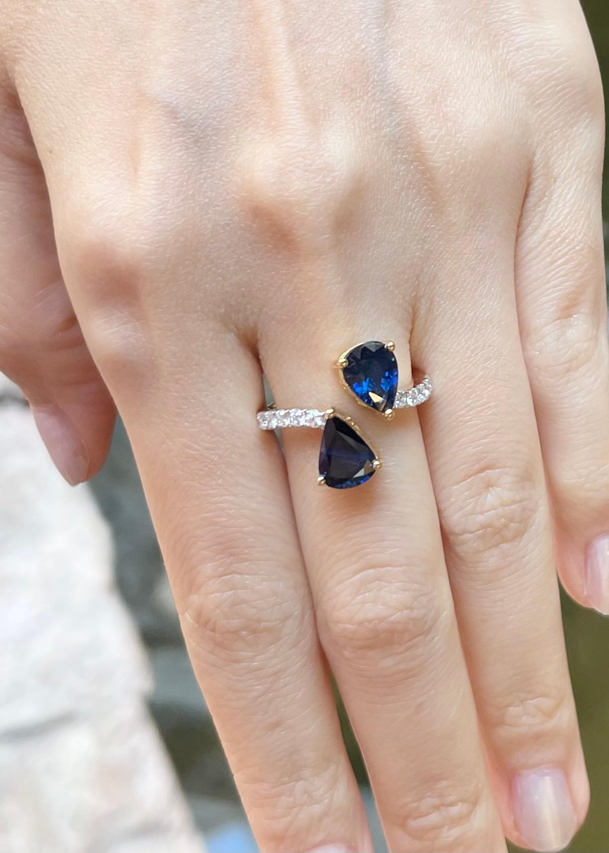 Pear Cut Blue Sapphire with Diamond Ring set in 18K Gold Settings For Sale