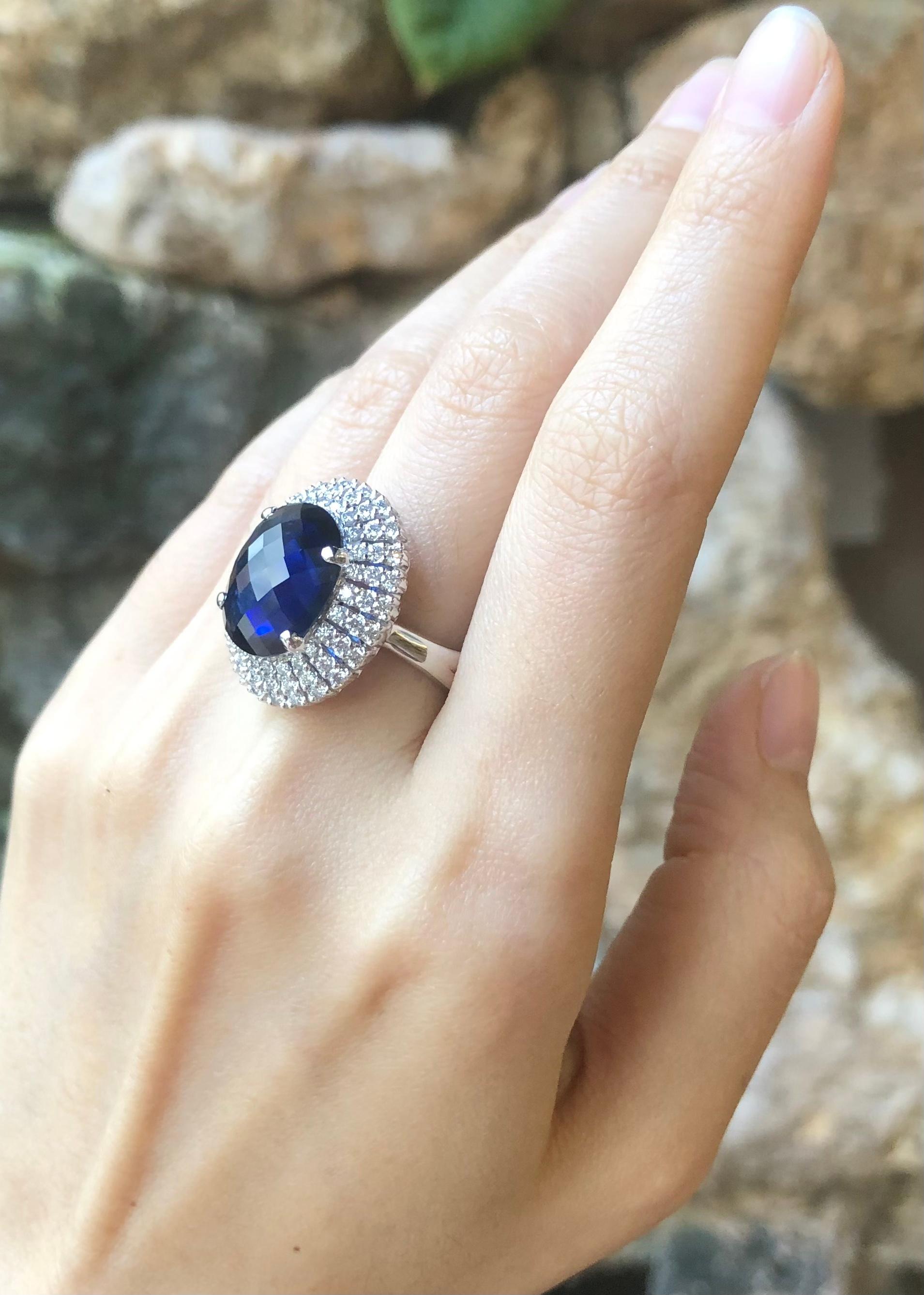 Blue Sapphire 7.80 carats with Diamond 0.91 carat Ring set in 18K White Gold Settings

Width:  1.8 cm 
Length: 2.2 cm
Ring Size: 54
Total Weight: 14.23 grams

