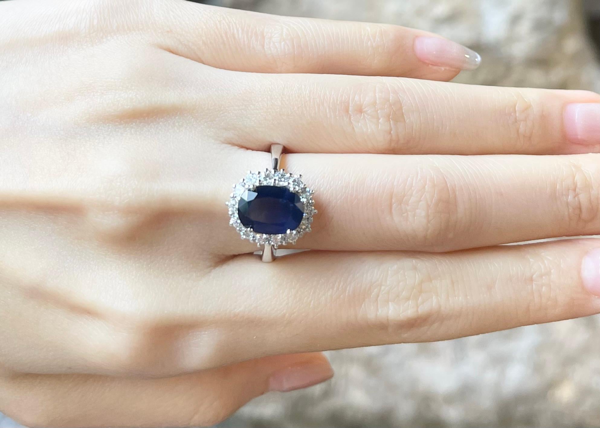 Contemporary Blue Sapphire with Diamond Ring set in 18K White Gold Settings For Sale