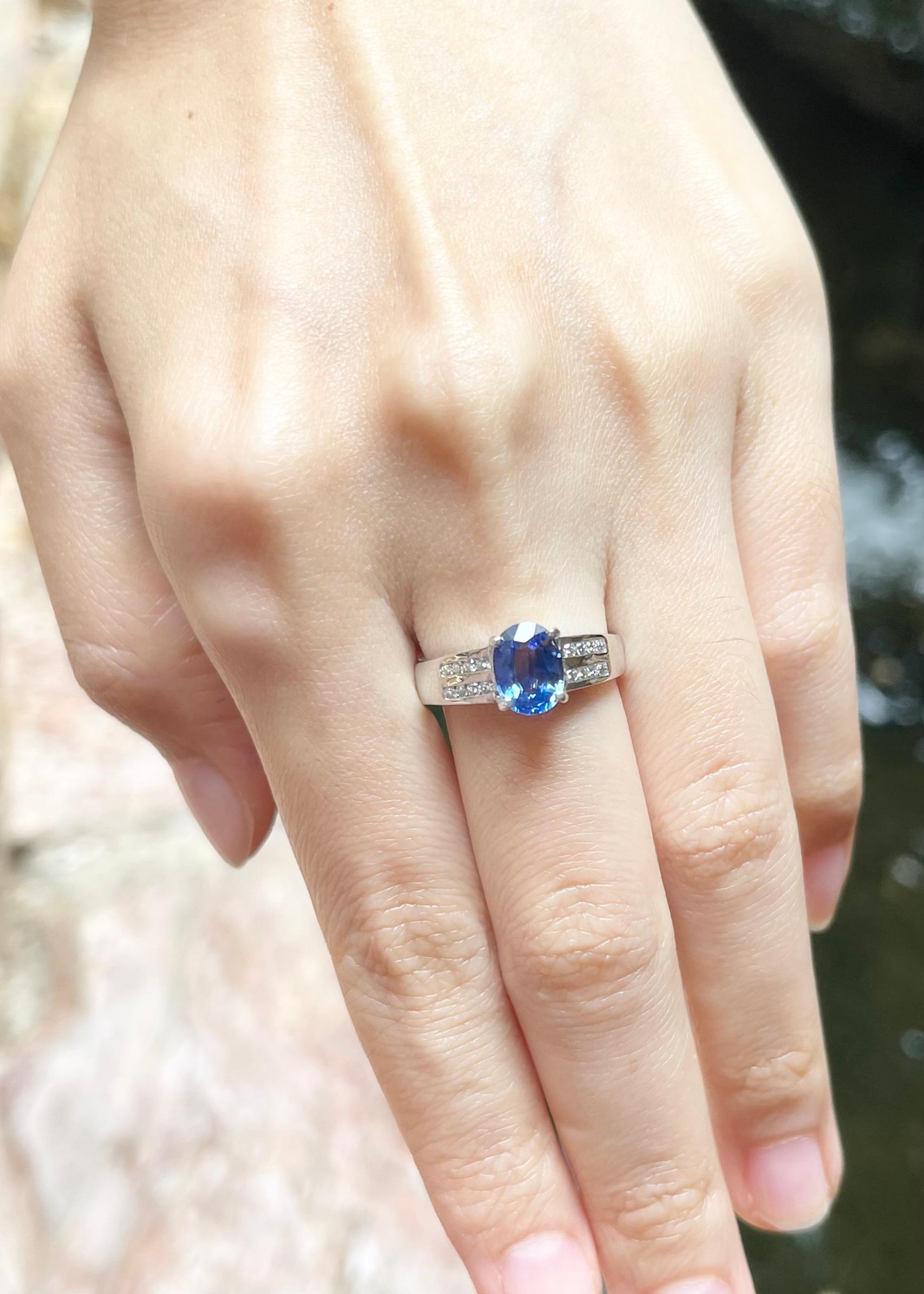 Oval Cut Blue Sapphire with Diamond Ring set in 18K White Gold Settings For Sale