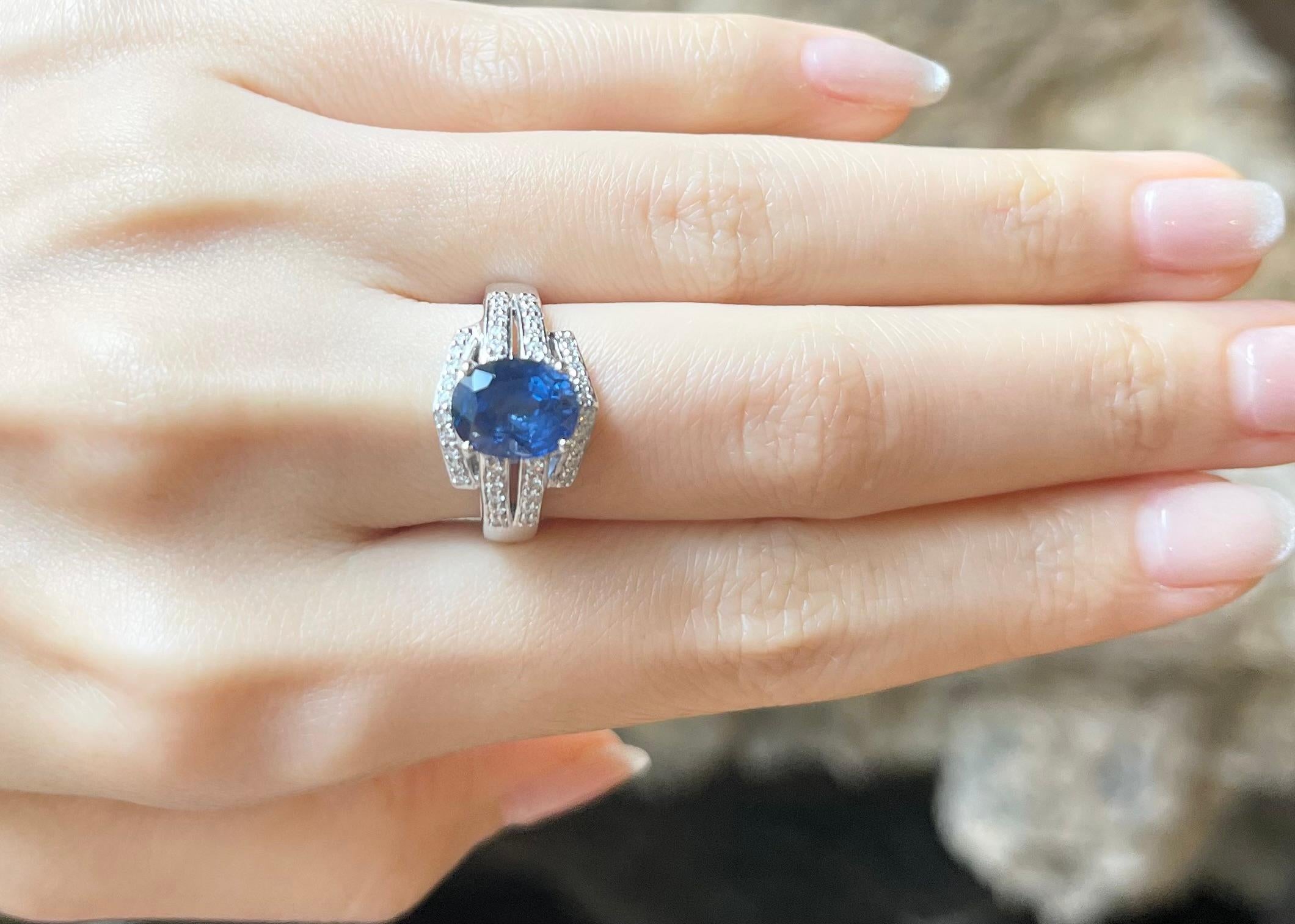 Oval Cut Blue Sapphire with Diamond Ring set in 18K White Gold Settings For Sale