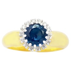 Bague en or blanc/jaune 18K sertie de saphirs bleus et de diamants