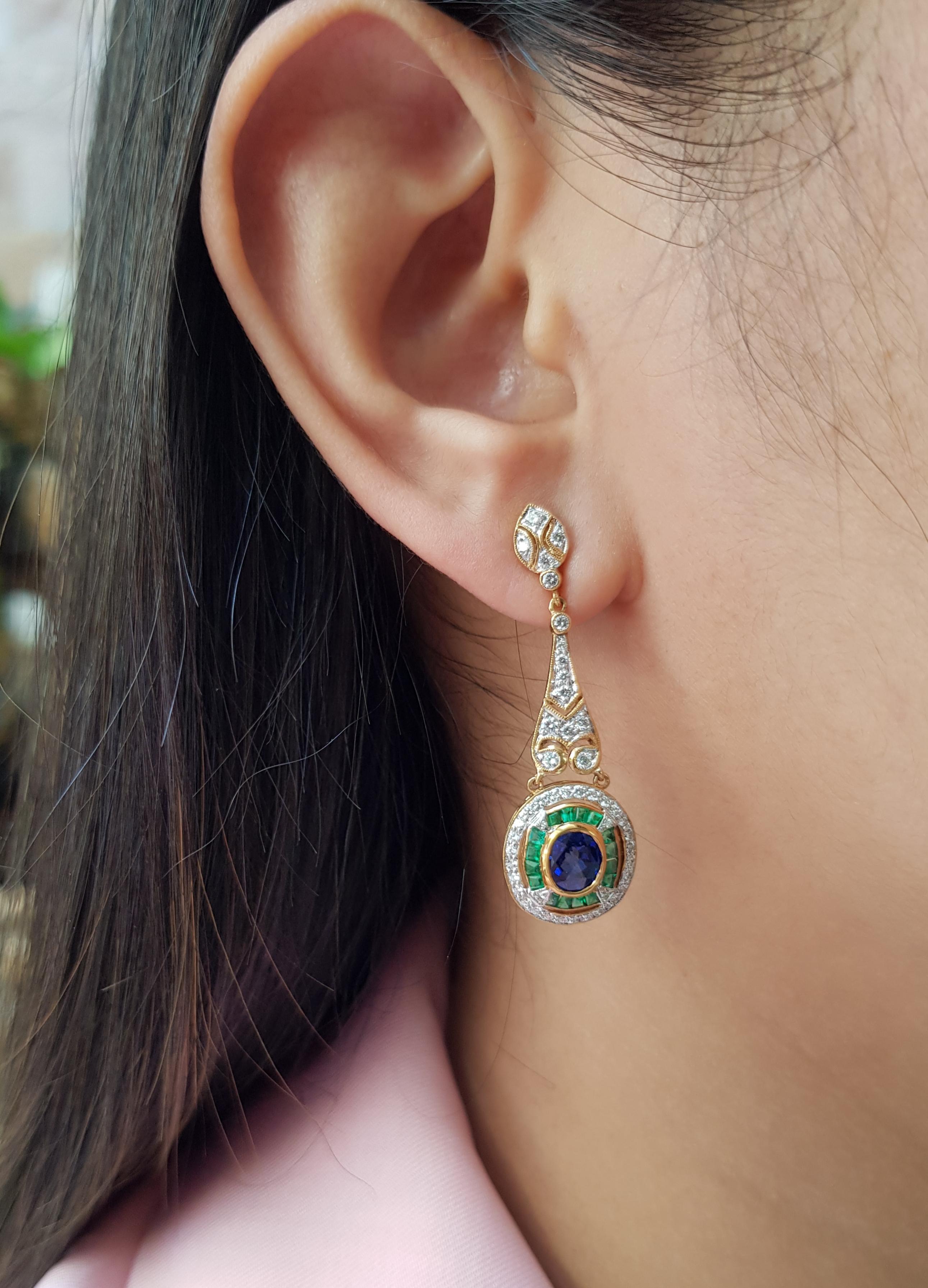 Blue Sapphire 1.65 carats with Emerald 0.82 carat and Diamond 0.84 carats Earrings set in 18 Karat Gold Settings

Width: 1.3 cm
Length: 4.1 cm 

