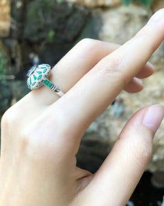Blue Sapphire with Emerald and Diamond Ring Set in 18 Karat White Gold Settings