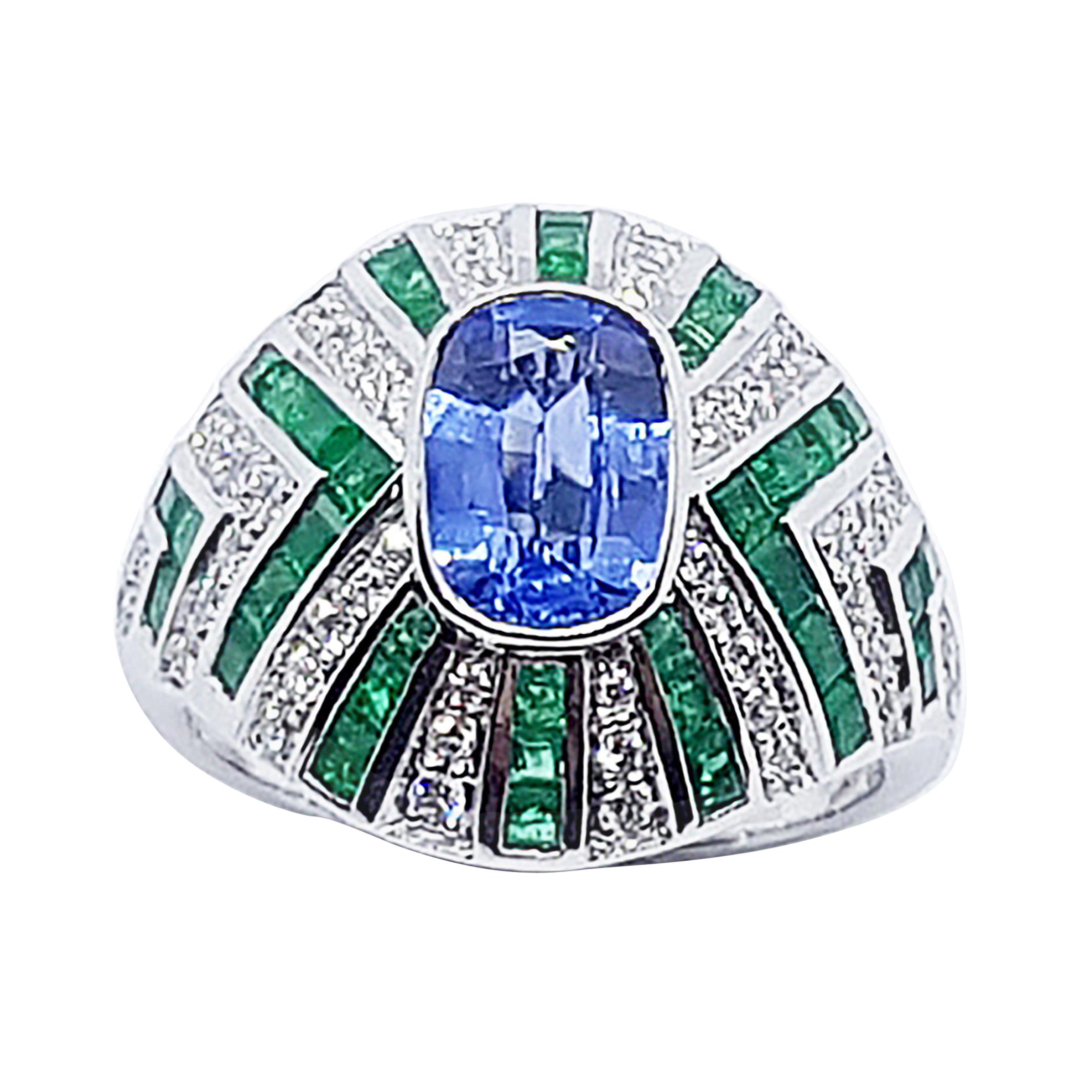 Blue Sapphire with Emerald and Diamond Ring Set in 18 Karat White Gold Settings
