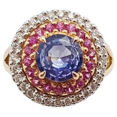 Bague en or rose 18 carats sertie de saphir bleu, saphir rose et diamants