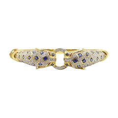 Blue Sapphire with Ruby and Diamond Panther Bangle Set in 18 Karat Gold Settings