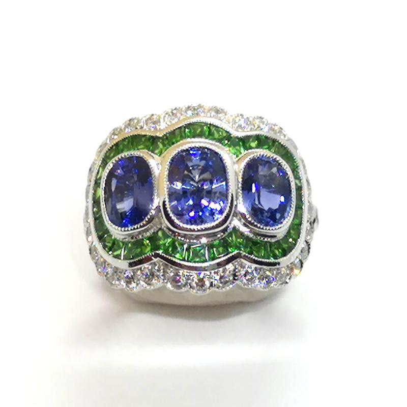 Blue Sapphire 3.21 carats with Tsavorite 1.69 carats and Diamond 0.68 carat Ring set in 18 Karat White Gold Settings

Width: 2.0 cm
Length: 1.8 cm 
Ring Size: 53

