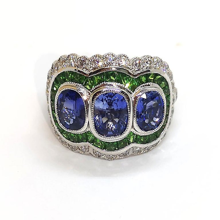 Art Deco Blue Sapphire with Tsavorite and Diamond Ring Set in 18 Karat White Gold For Sale
