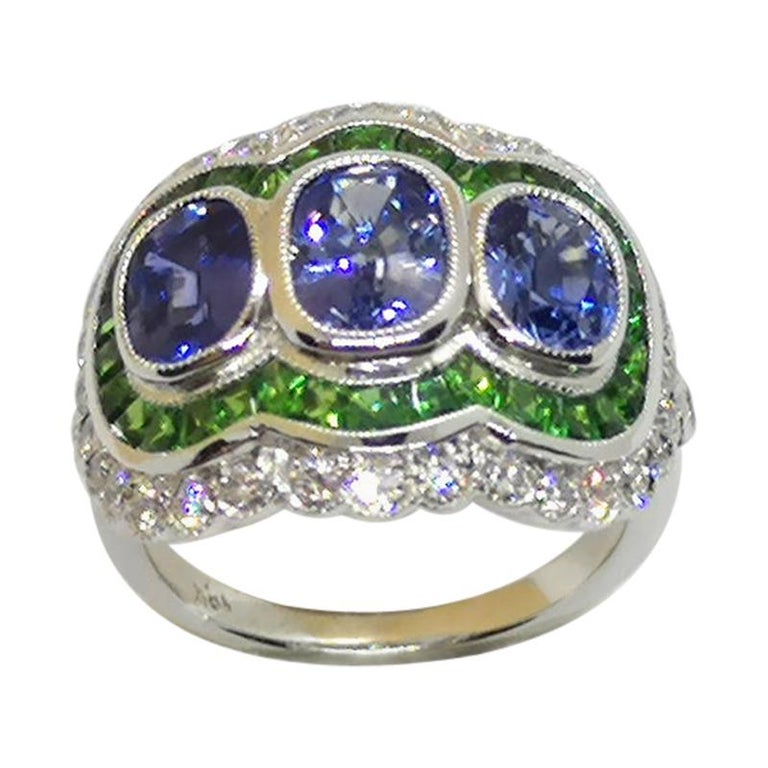 Blue Sapphire with Tsavorite and Diamond Ring Set in 18 Karat White Gold For Sale