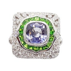 Bague en or blanc 18 carats sertie d'un saphir bleu avec tsavorite et de diamants