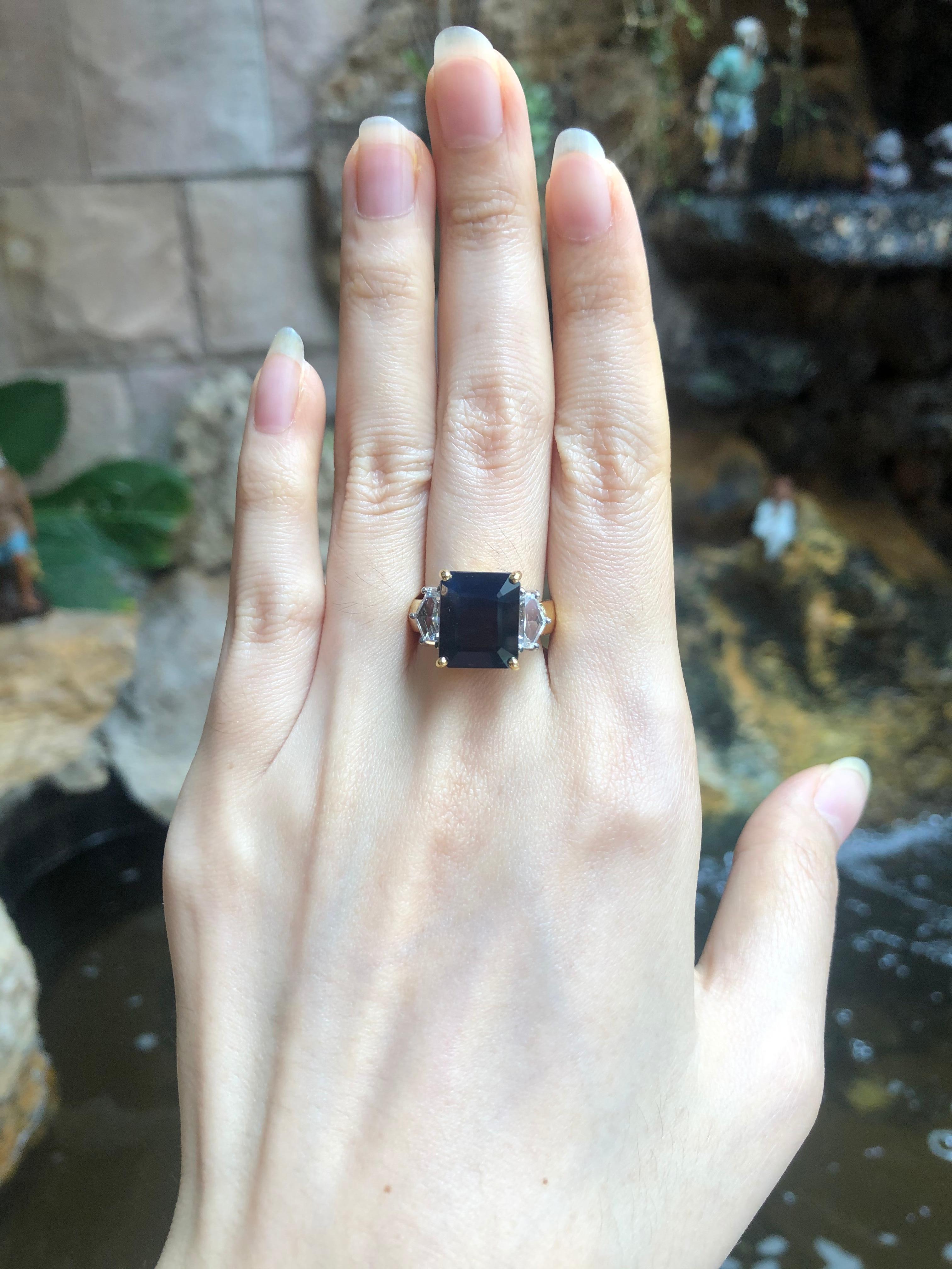 Black Sapphire 10.40 carats with Shield Cut White Sapphire1.52 carats Ring set in 18 Karat Gold Settings

Width:  2.0 cm 
Length: 1.2 cm
Ring Size: 54
Total Weight: 12.56 grams

