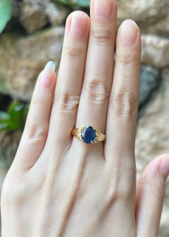 Blue Sapphire with Yellow Diamond Ring set in 18K Gold Settings
