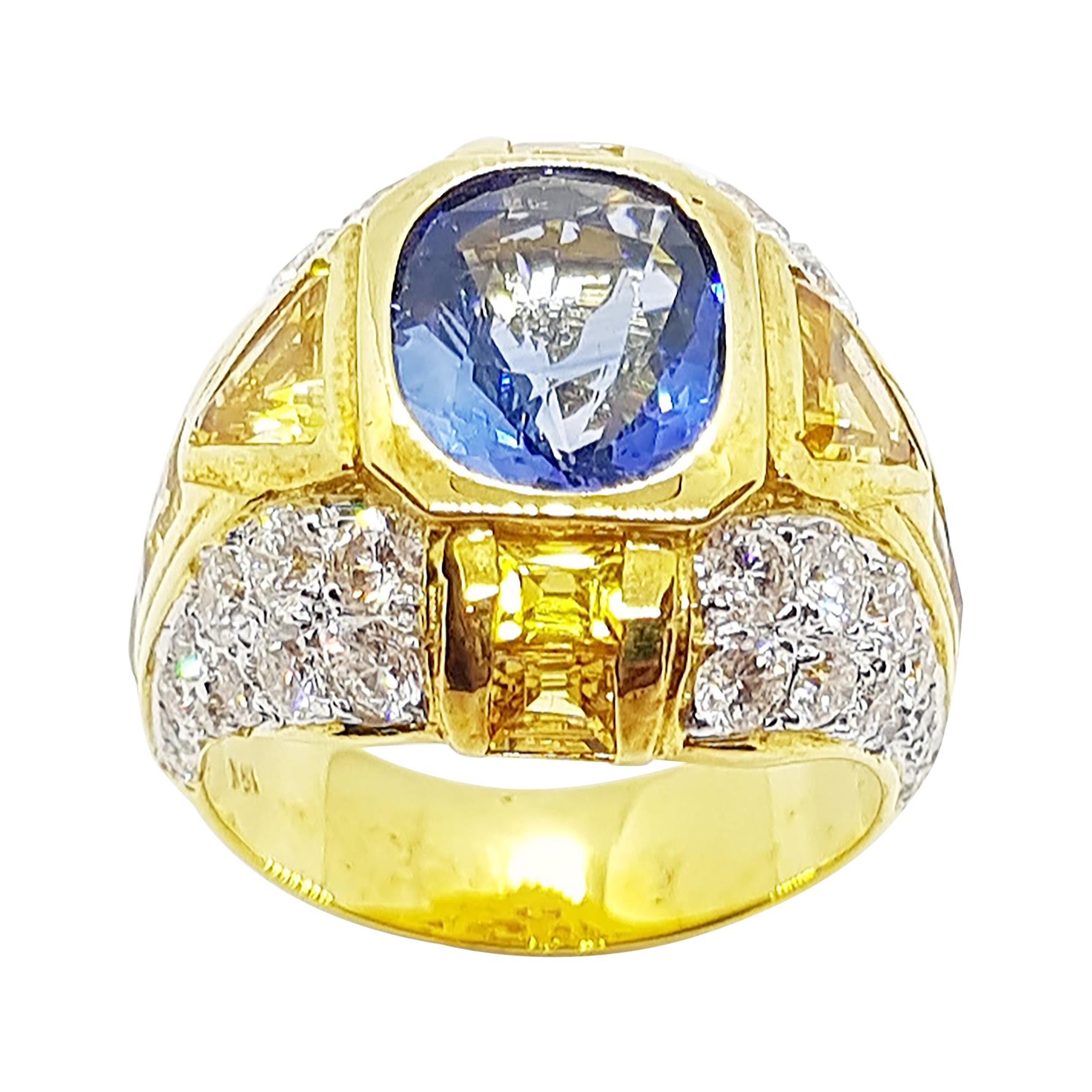 Anillo de zafiro azul con zafiro amarillo y diamantes engastado en oro de 18 quilates