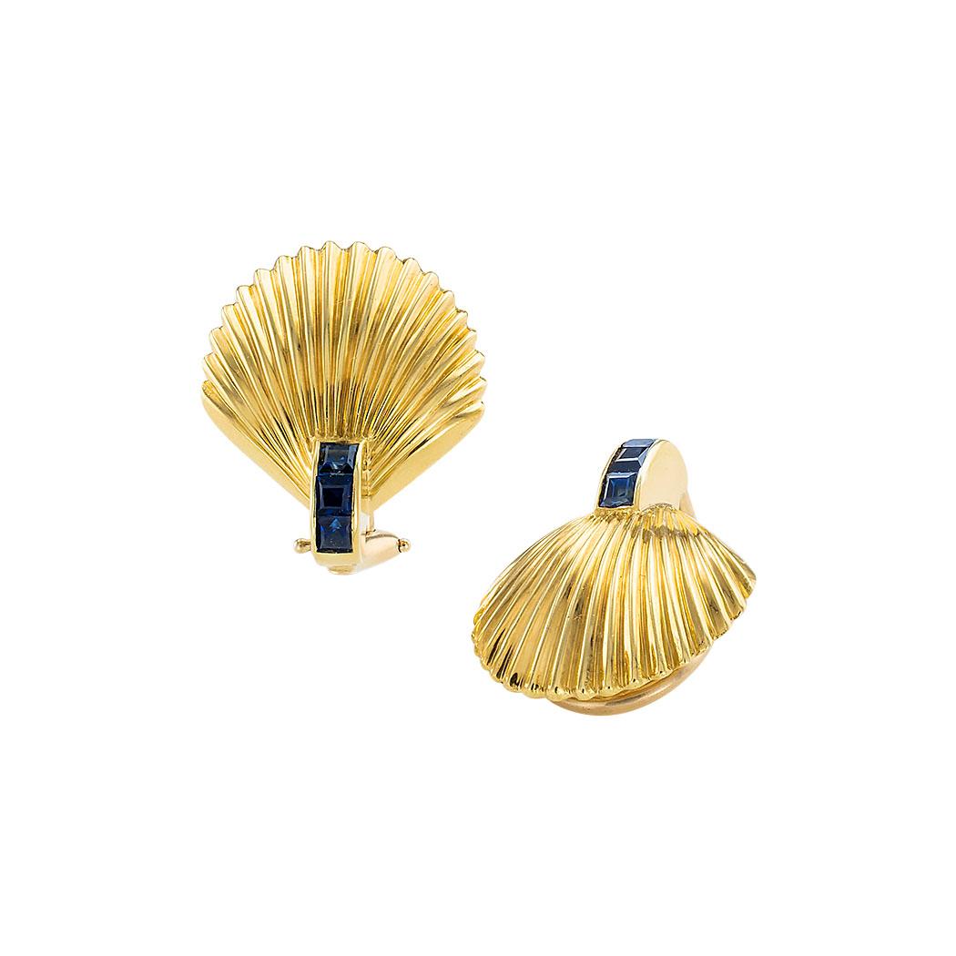 Estate blue sapphire and yellow gold clamshell clip-on earrings circa 1960.  

Contact us right away if you have additional questions.  We are here to connect you with beautiful and affordable antique and estate jewelry.

SPECIFICATIONS:

GEMSTONES: