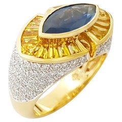 Anello con zaffiro blu, zaffiro giallo e diamante incastonati in oro 18 carati