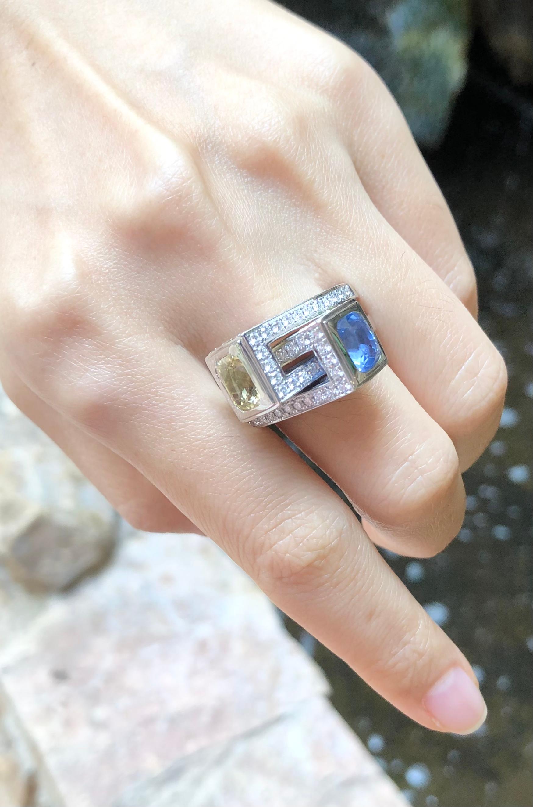 Blue Sapphire 2.99 carats, Yellow Sapphire 3.04 carats with Diamond 2.36 carats Ring set in 18 Karat White Gold Settings

Width:  2.1 cm 
Length: 1.4 cm
Ring Size: 55
Total Weight: 26.29 grams

