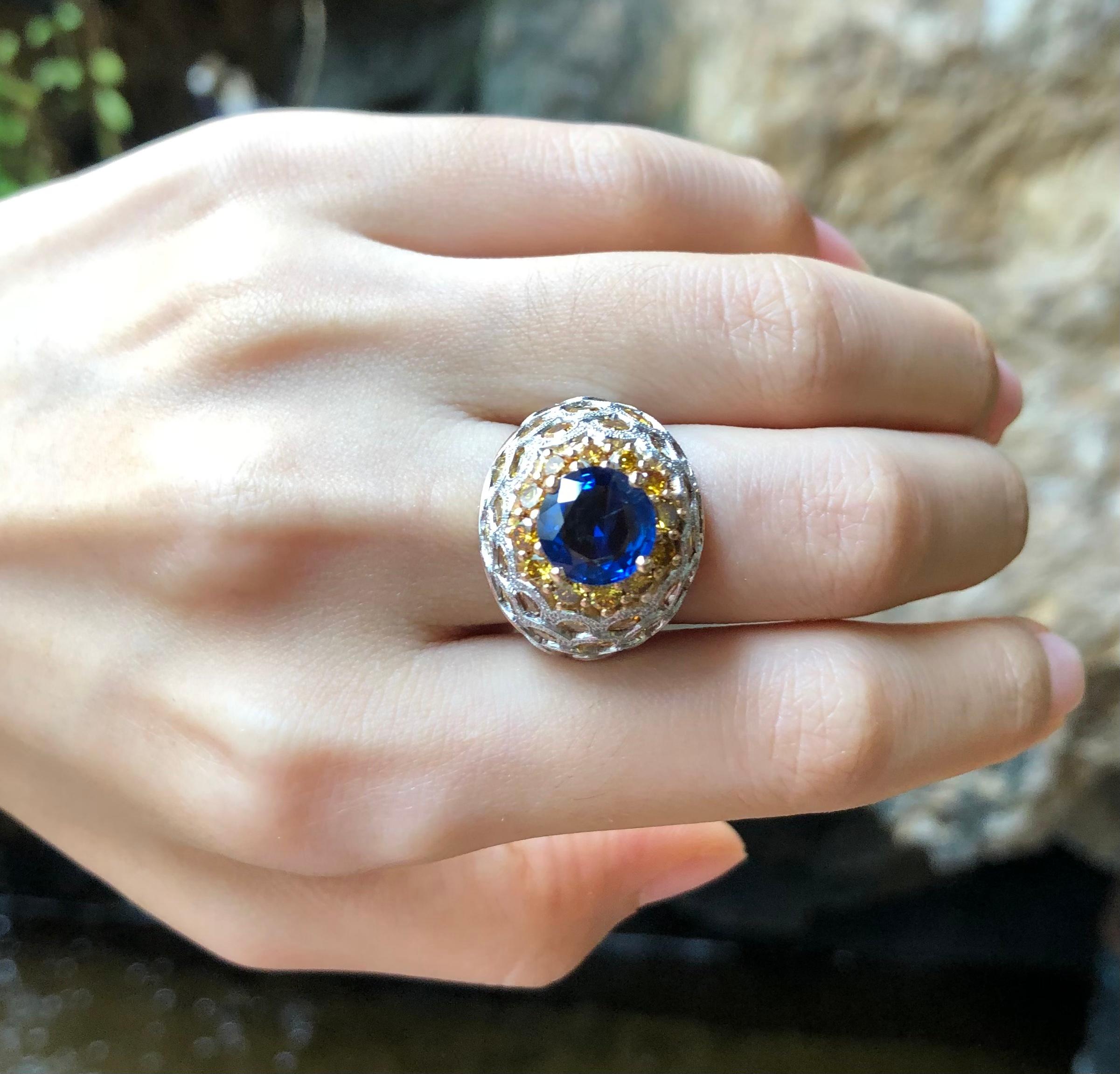 Contemporary Blue Sapphire, Yellow Sapphire, Yellow Diamond and Diamond Ring in 18 Karat Gold For Sale