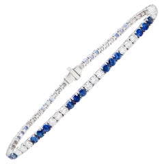 Tennisarmband mit blauen Saphiren und Diamanten im Rundschliff 5.3 Karat 18K Gold