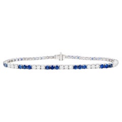 Bracelet tennis en or 18 carats, saphirs bleus et diamants taille ronde de 5,3 carats